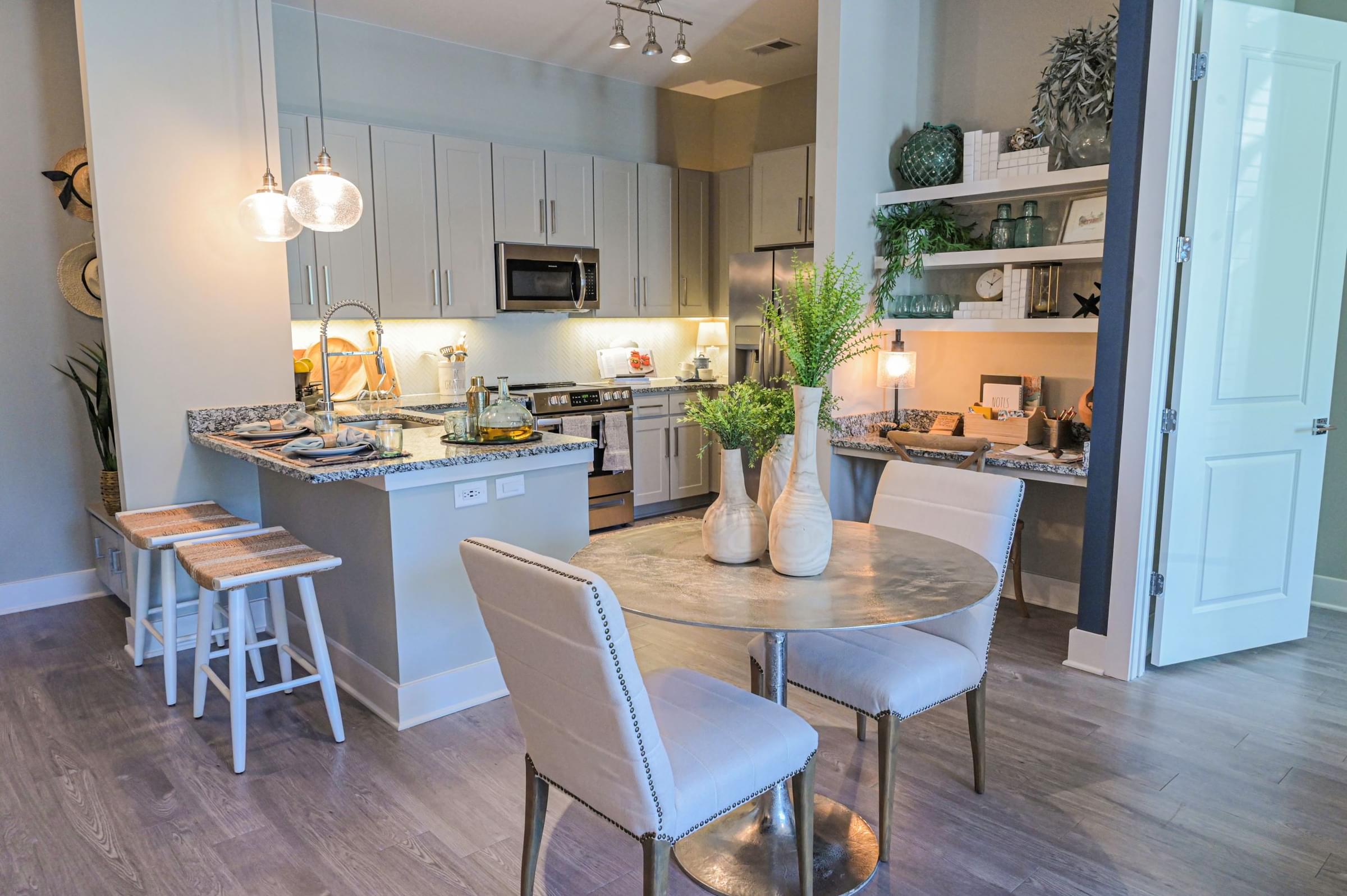 Designer Kitchen Featuring Granite Countertops and Modern Stainless Steel Appliances