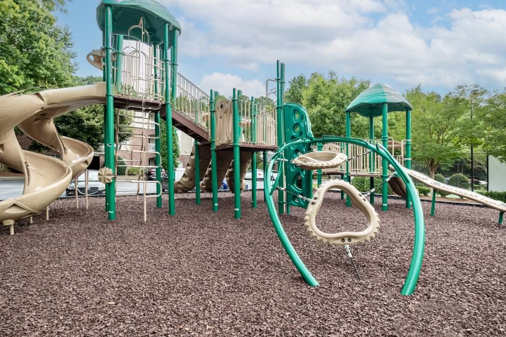 a playground with a slide and other playground equipment