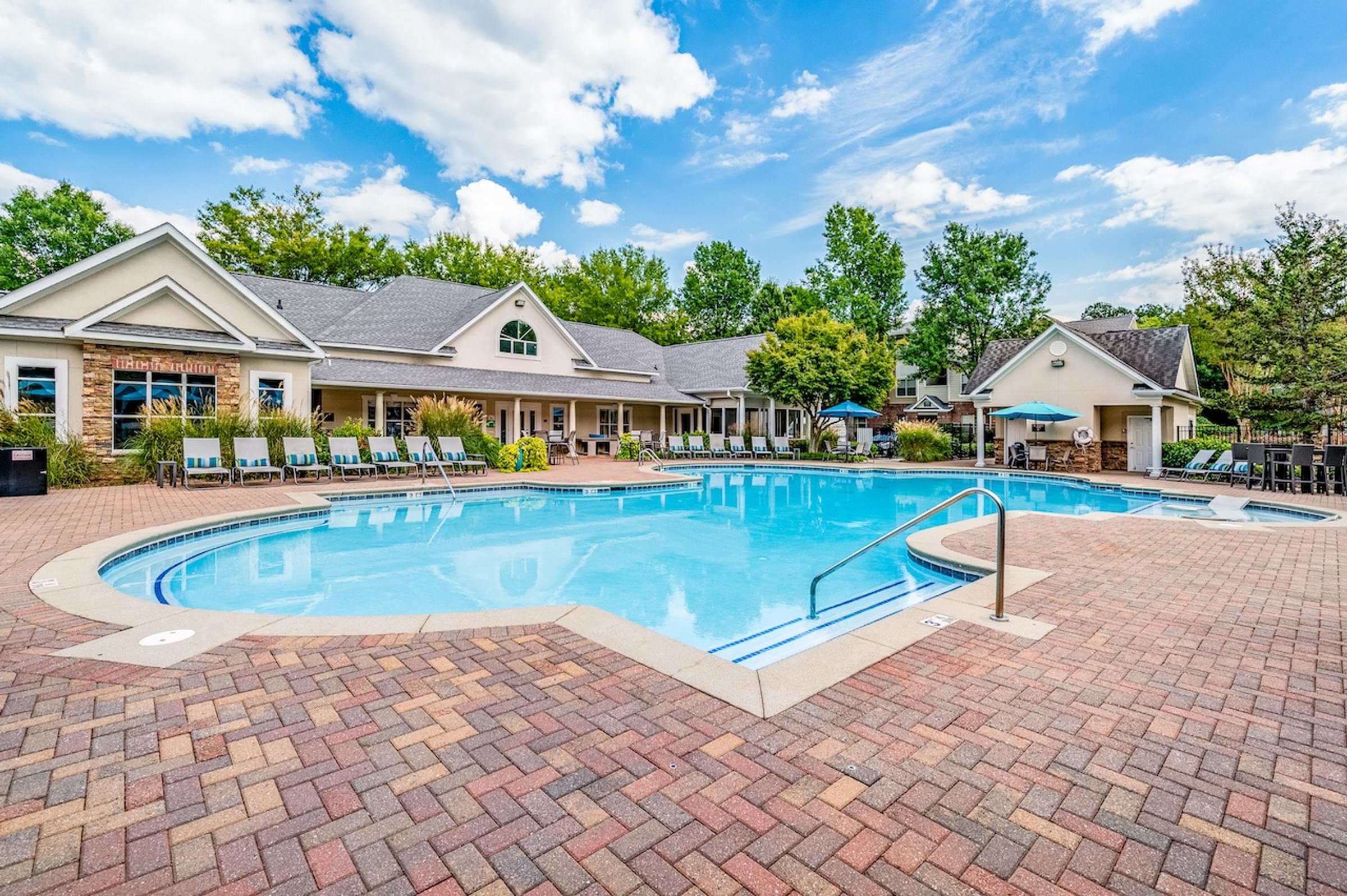 Resort-style saltwater swimming pool with in-pool lounge chairs at Hawthorne at Kennesaw in Kennesaw, GA