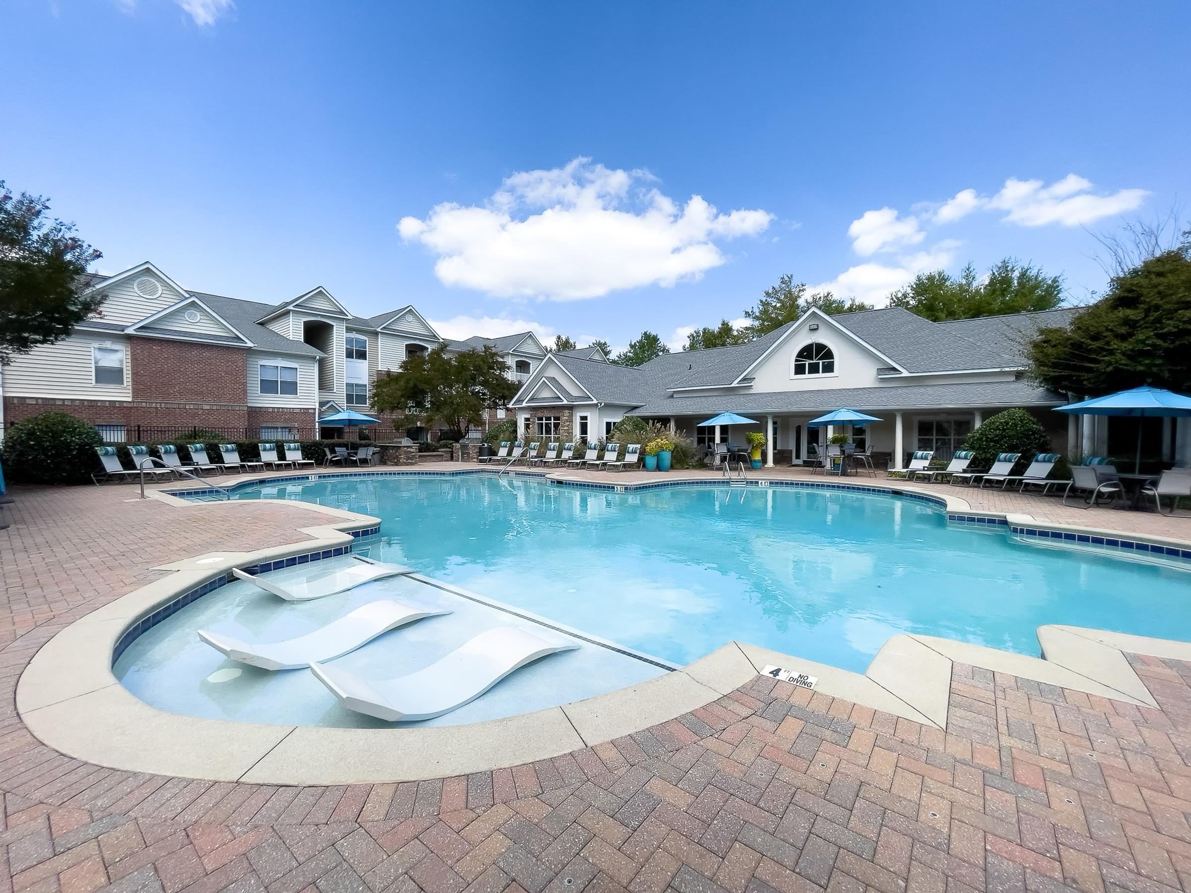 Resort-Style Saltwater Swimming Pool with In-Pool Lounge Chairs