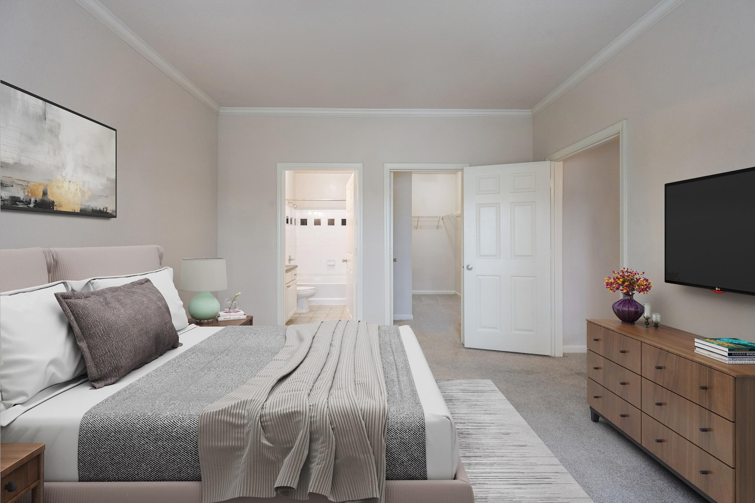 A bedroom with a bed, dresser, and a painting on the wall.