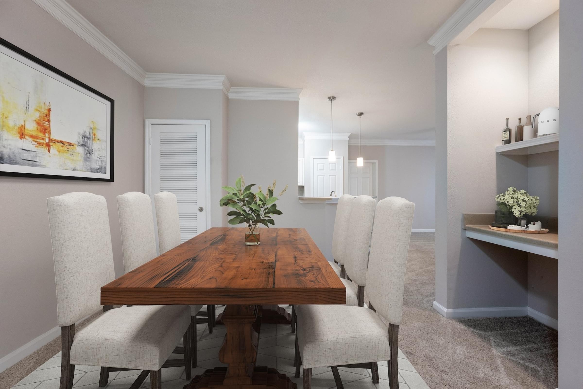 A dining room with a wooden table and chairs.