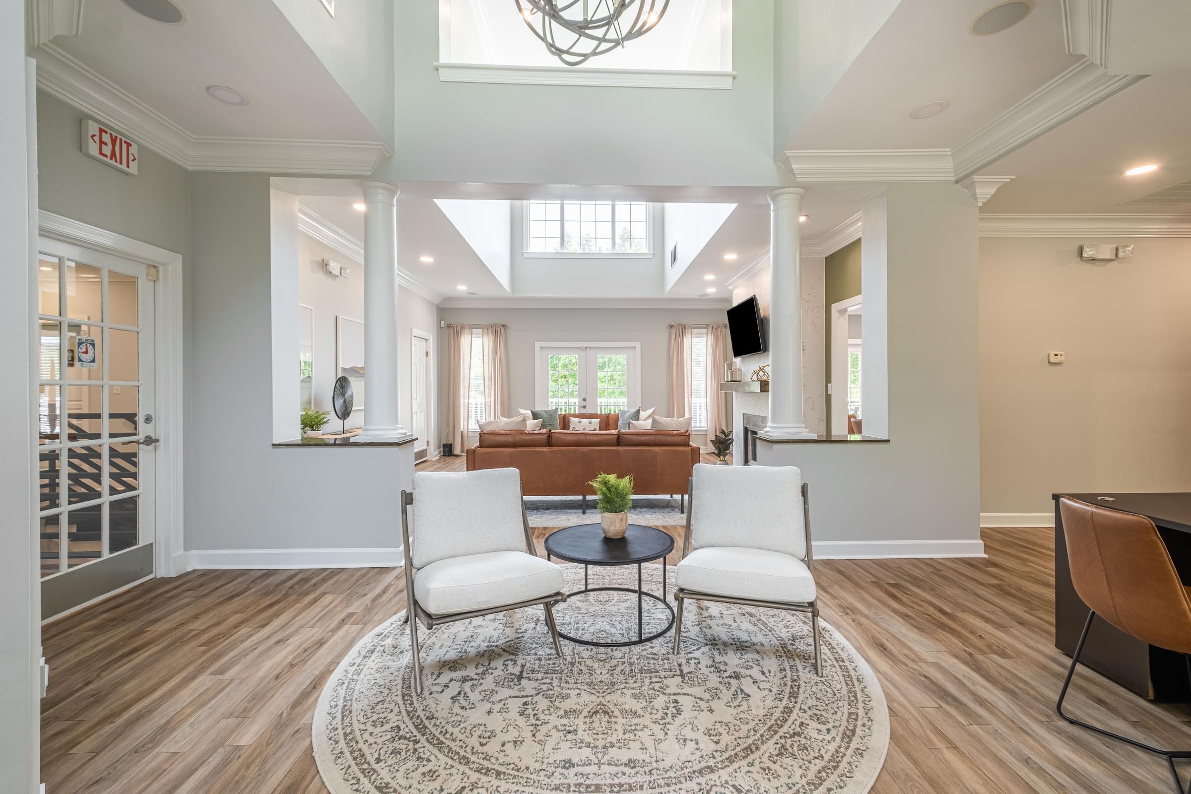 a living room with two chairs and a table