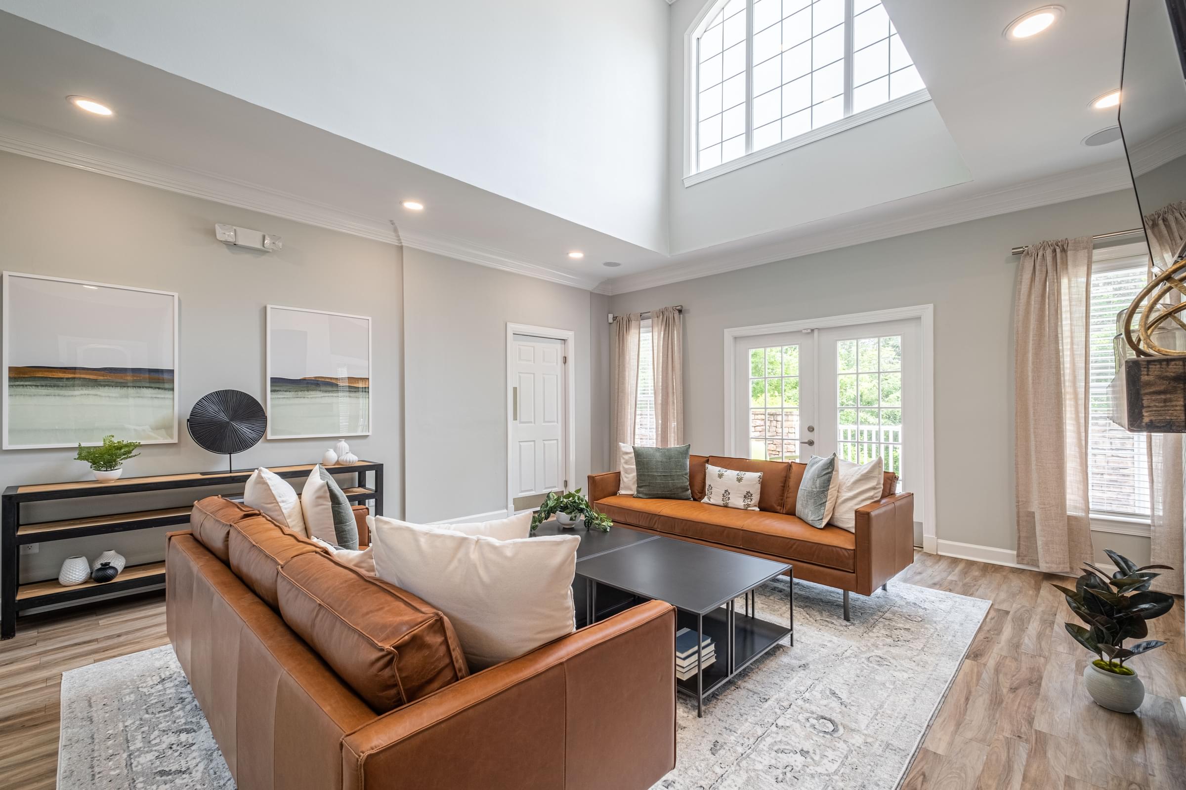 an open living room with couches and a table