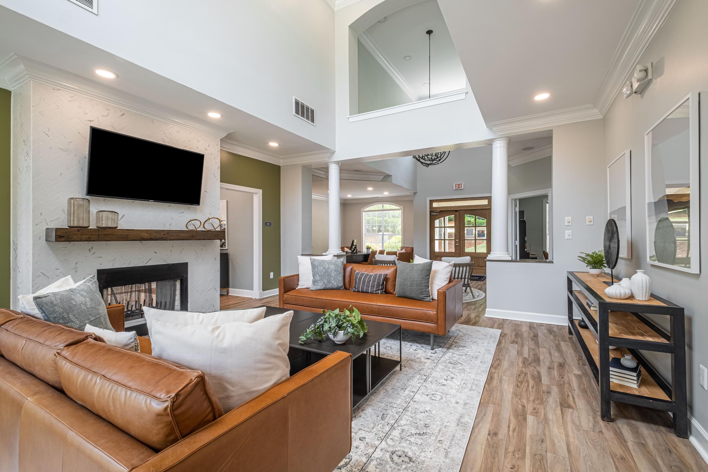a living room with couches and a fireplace