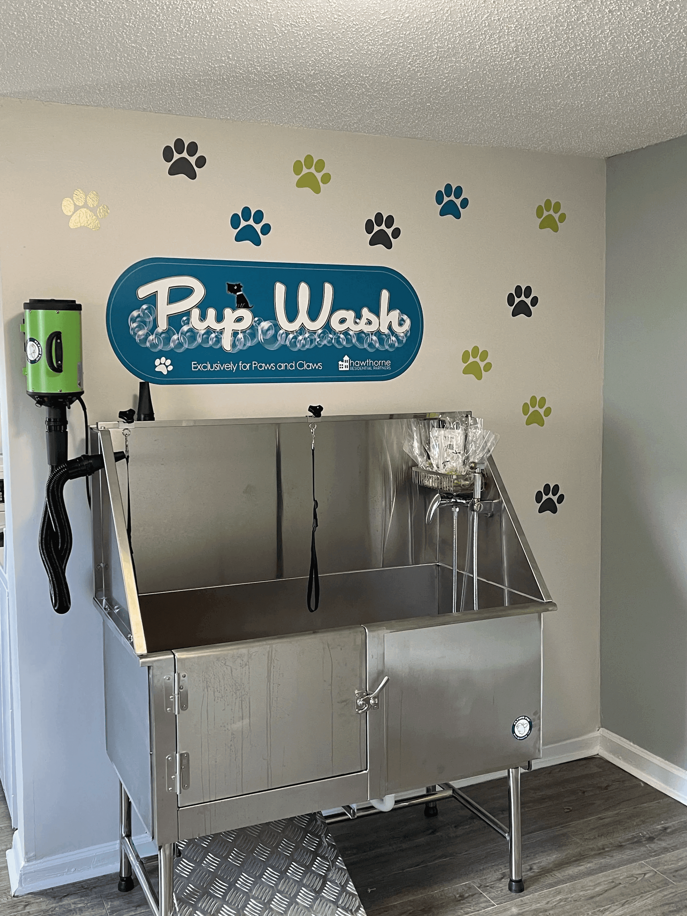 a kitchen with a sink and a sign on the wall
