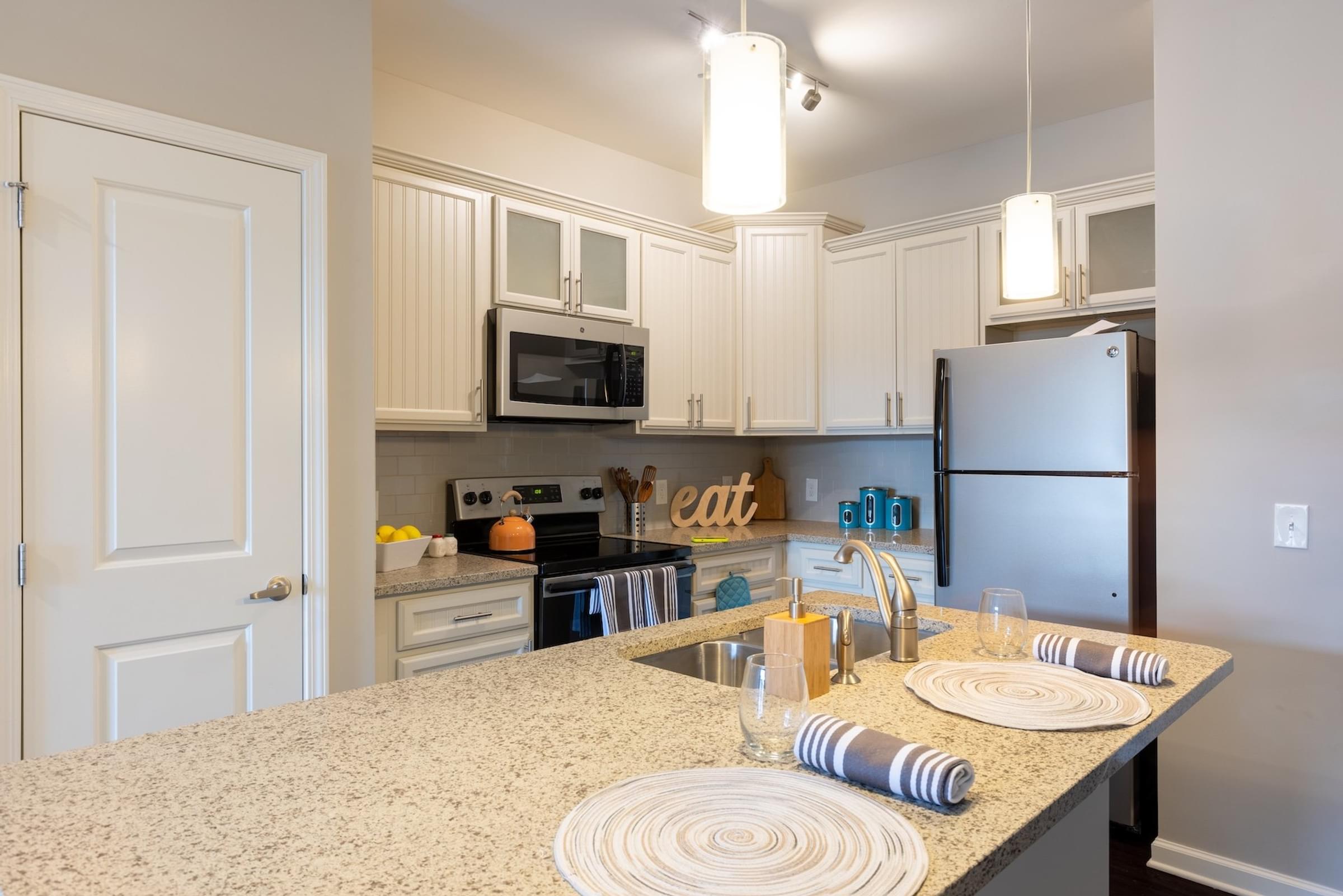 Kitchens with Weathered Gray or Aspen White Cabinetry Available