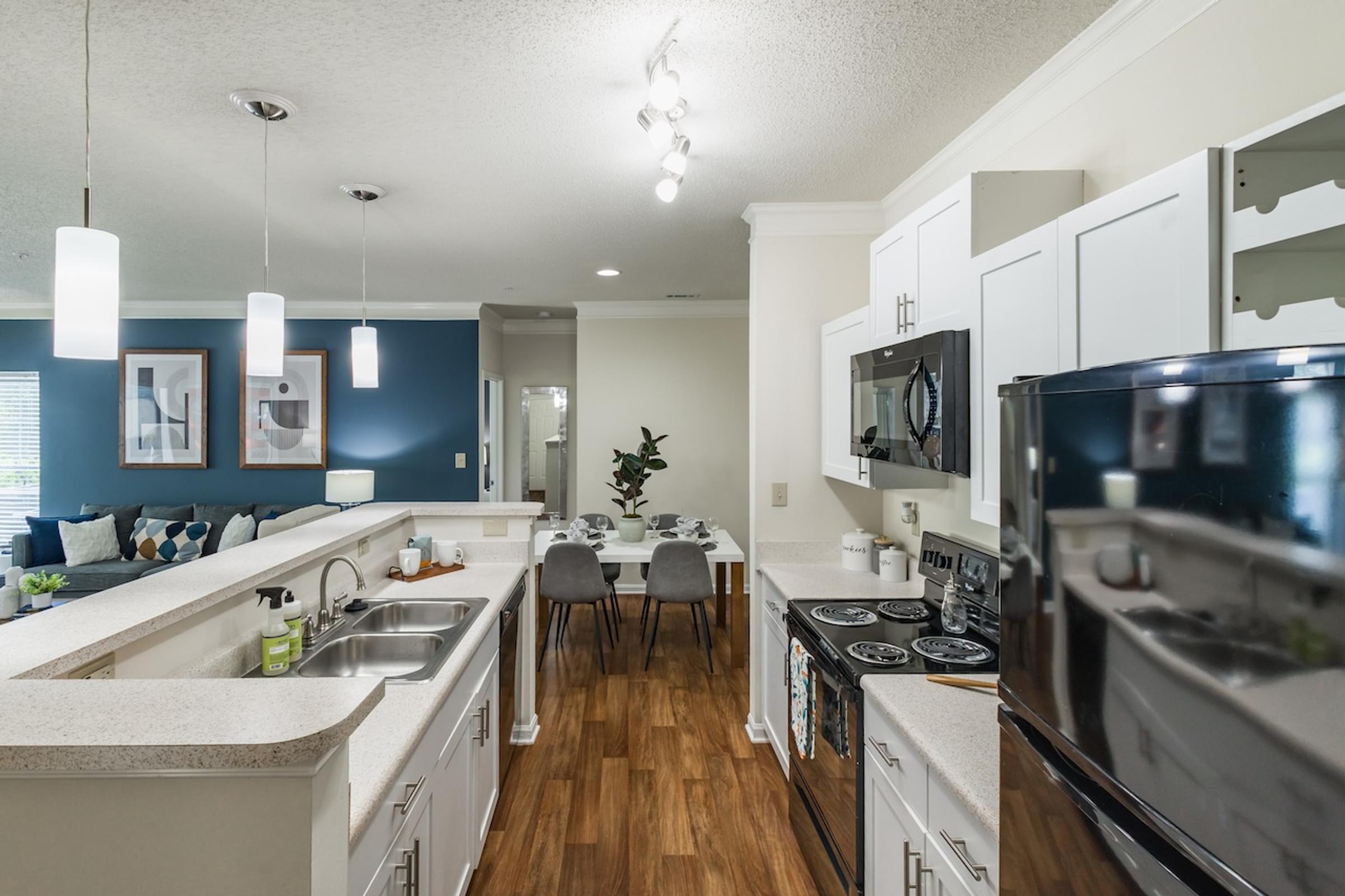 Modern Kitchen with Black Appliances and Breakfast Bar