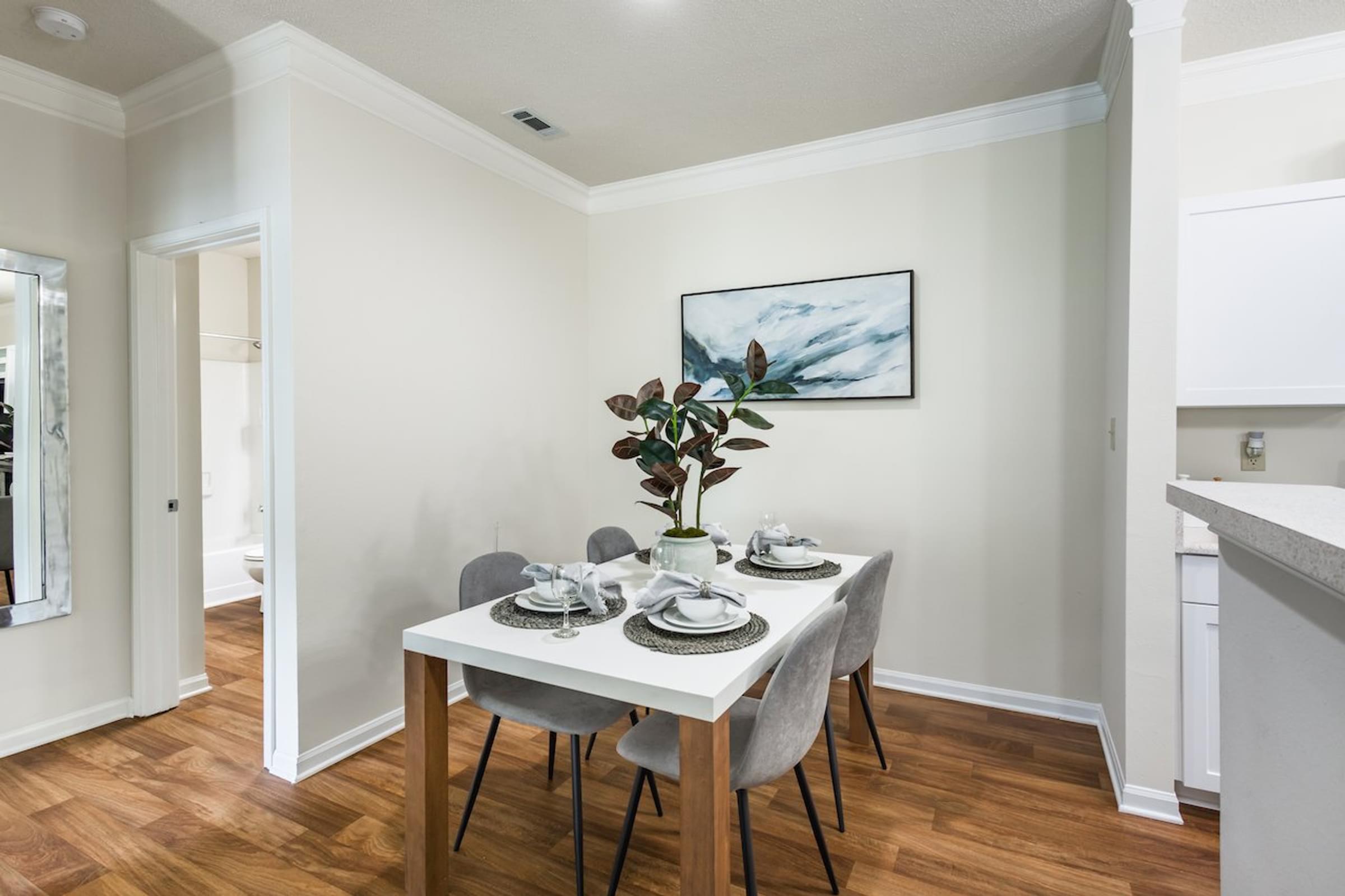 a dining room with a table and chairs