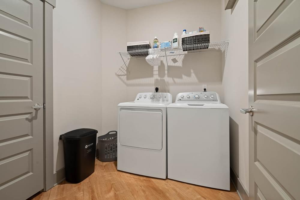 a washer and dryer in a laundry room with a door