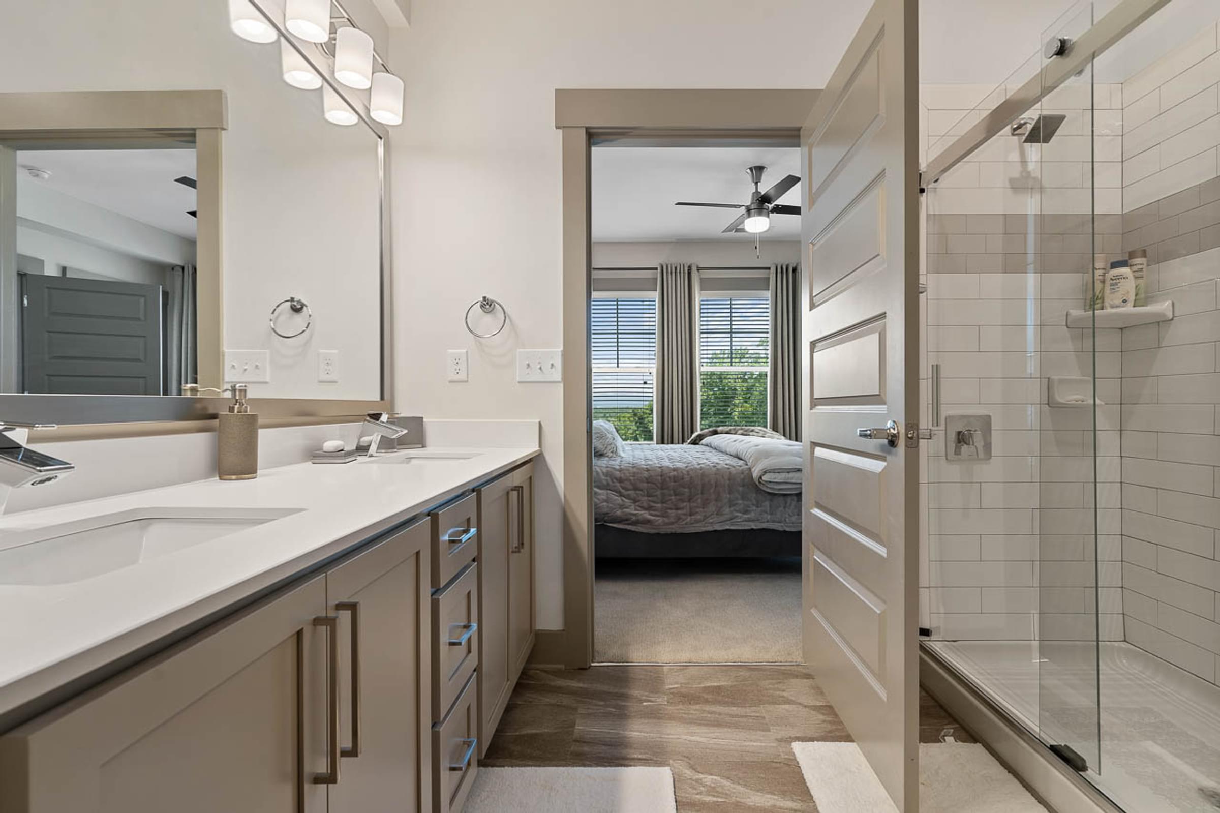 Modern Bathroom with Glass Shower and Double Vanities