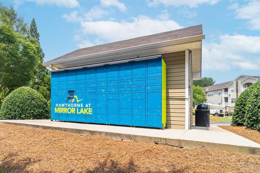 a small building with a blue door and a sign that reads fairhope air micro lake