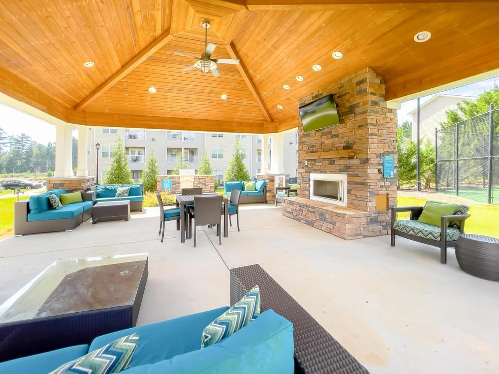 the preserve at ballantyne commons spacious patio with furniture and a fireplace