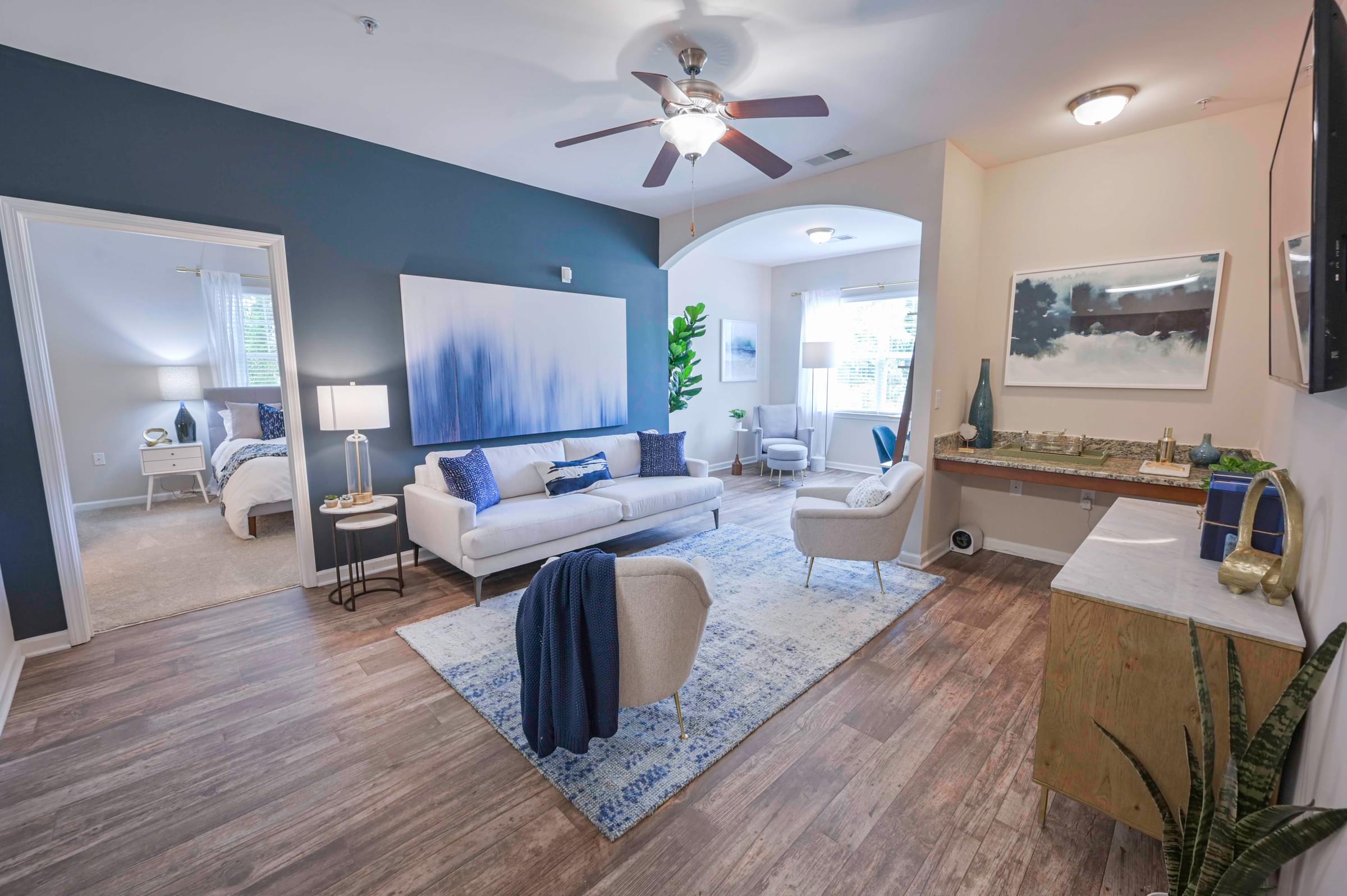 Open-Concept Living Room and Sunroom with Built-in Desk