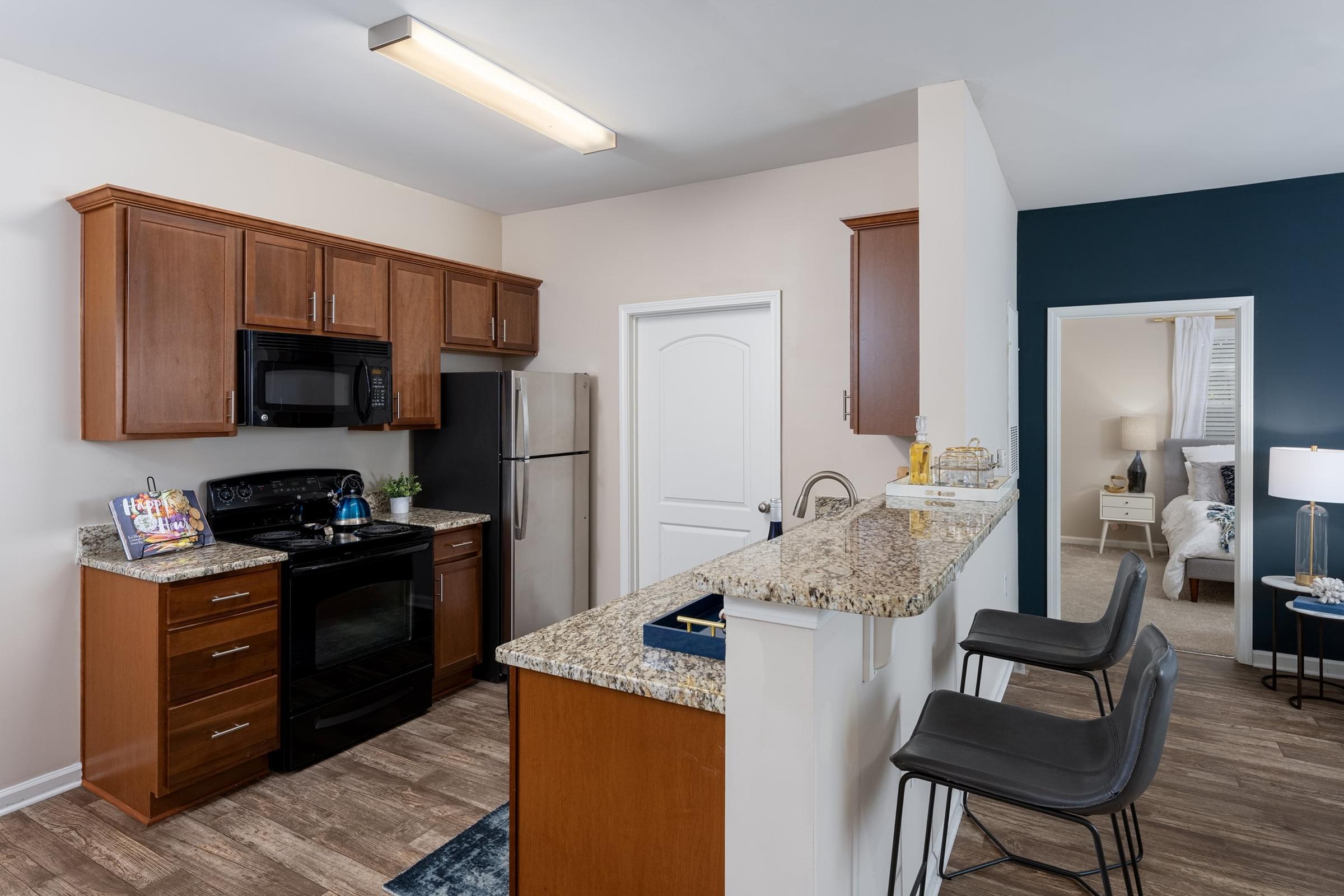 Designer Cabinetry, Granite Countertops, and Stainless Steel Appliances