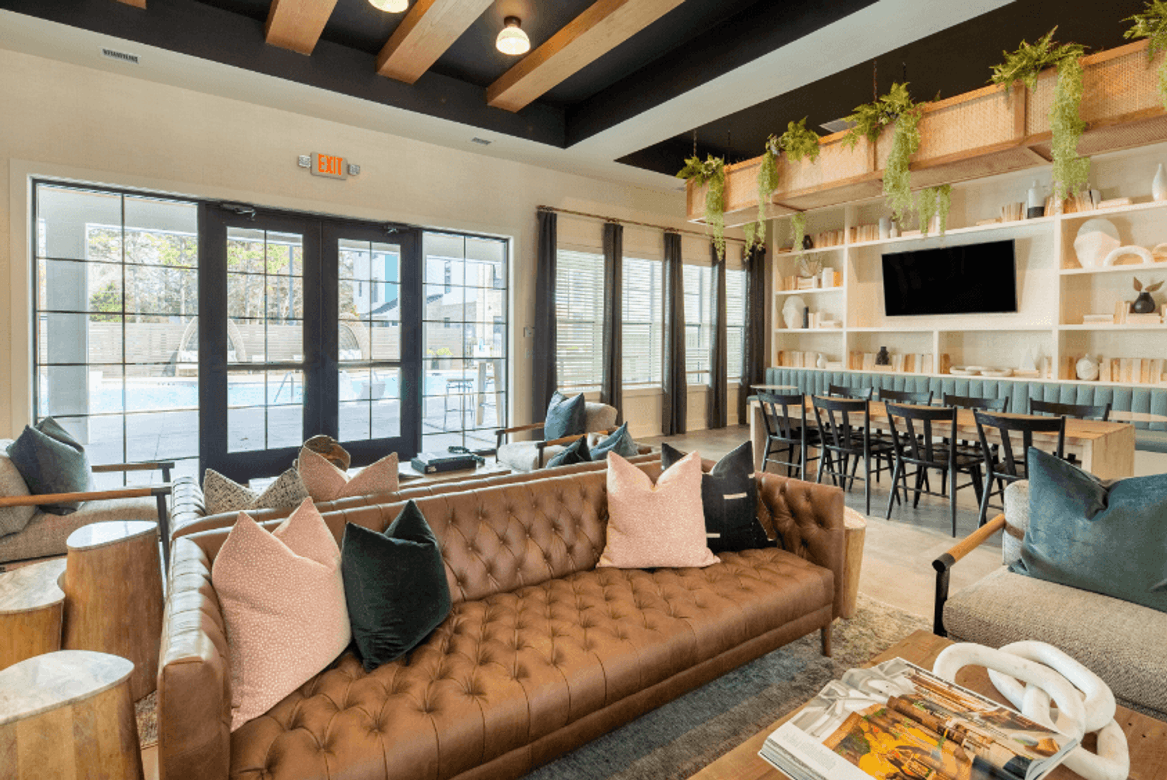 a living room with a couch and a table with chairs