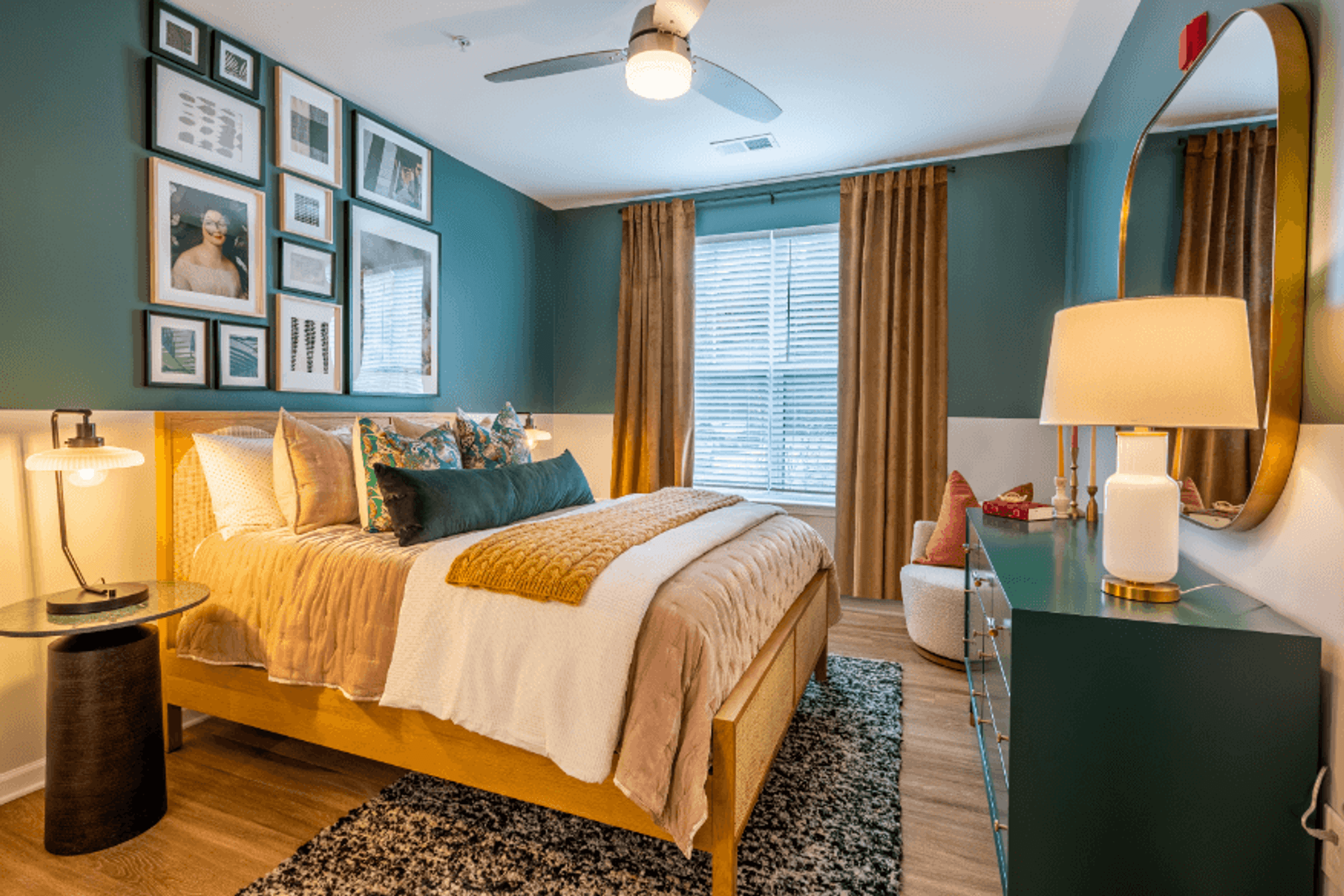 a bedroom with a bed and pictures on the wall