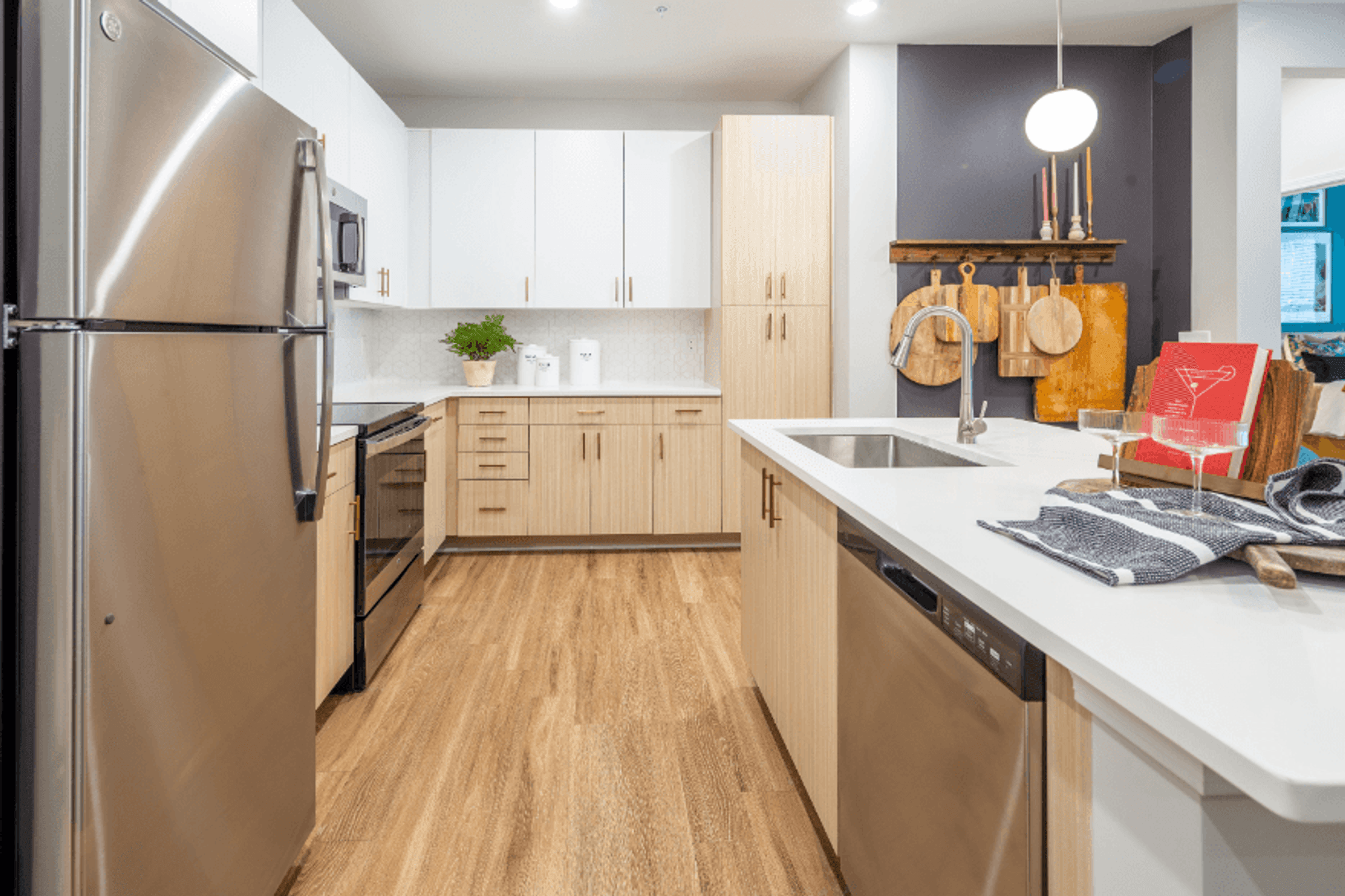 a kitchen with stainless steel appliances and a white counter top