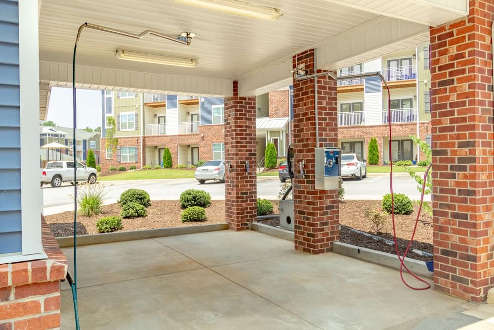 the preserve at ballantyne commons apartment community entrance with gas pump