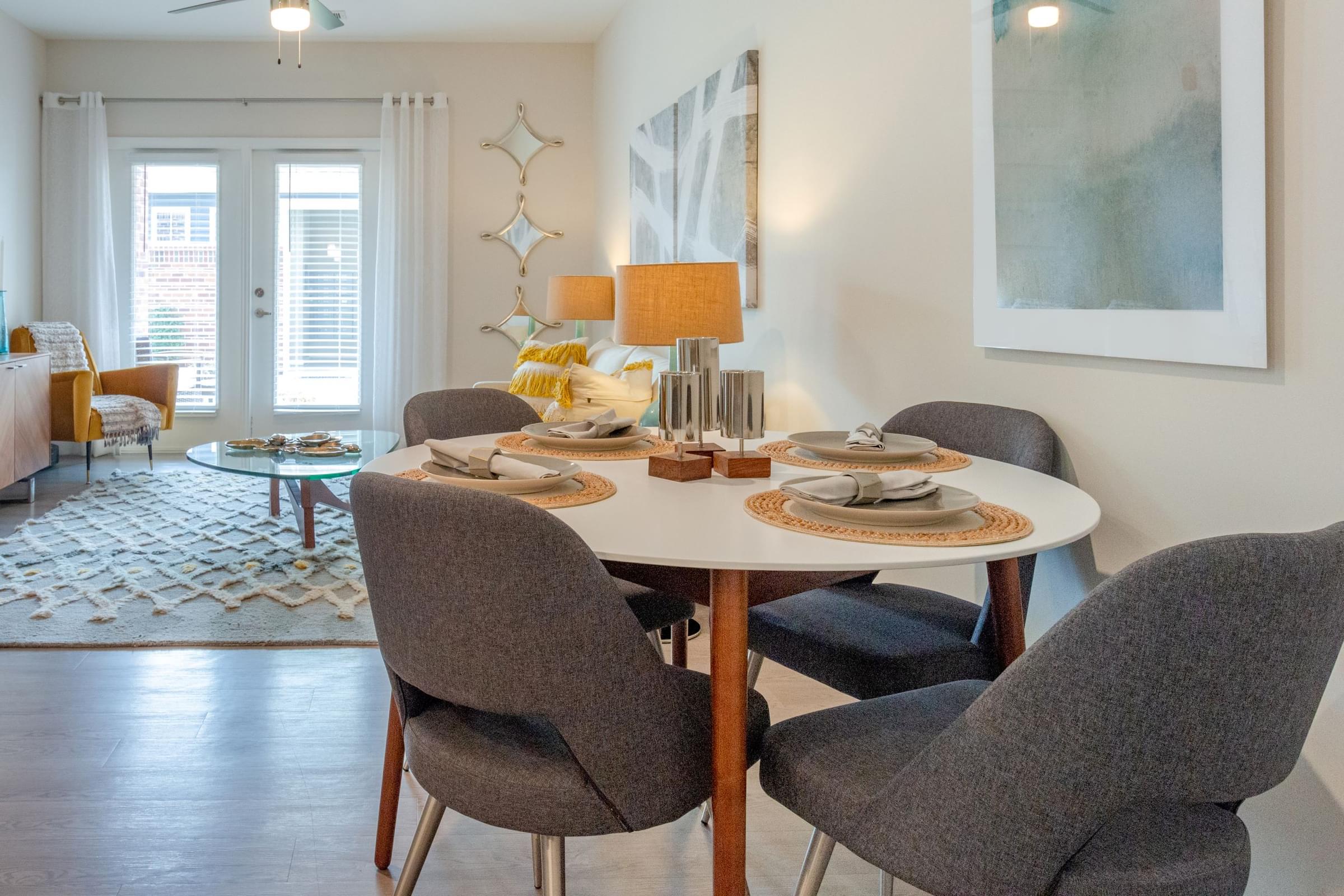 a dining room with a table and chairs