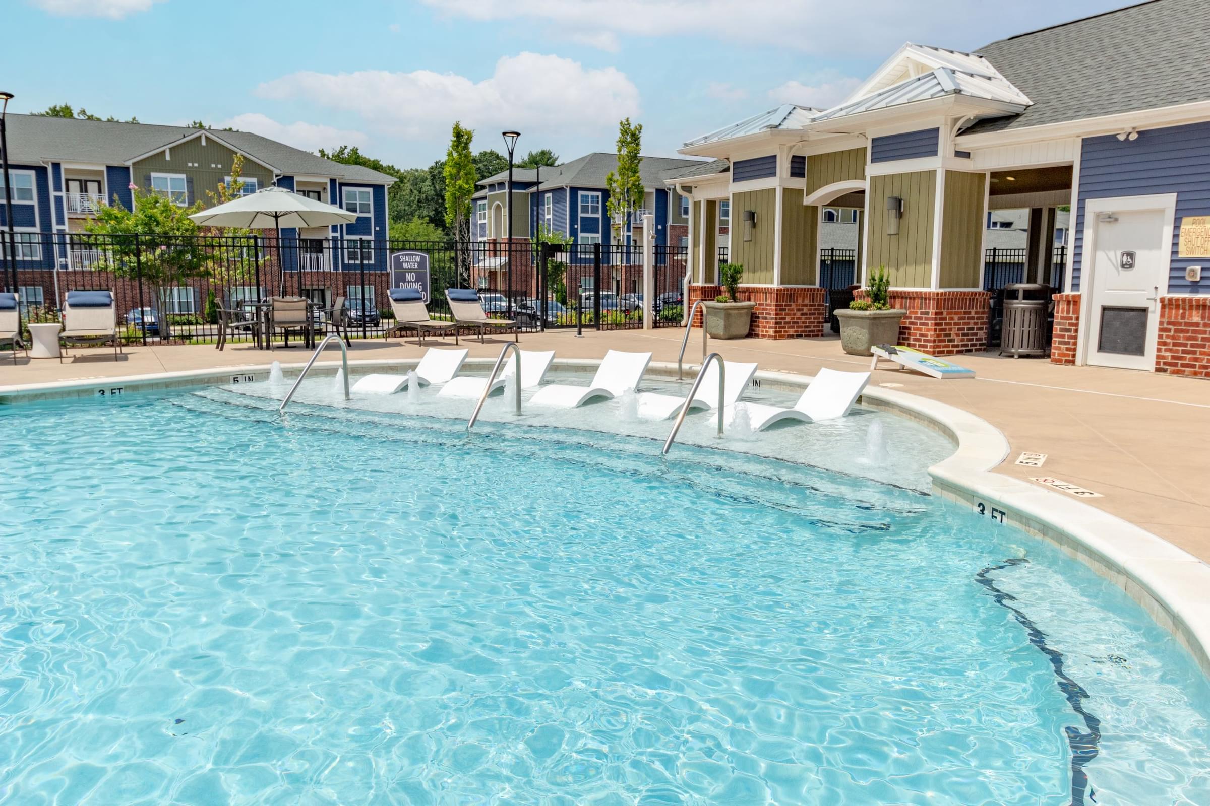 Resort-Style Swimming Pool with Sun Shelf and Expansive Sundeck