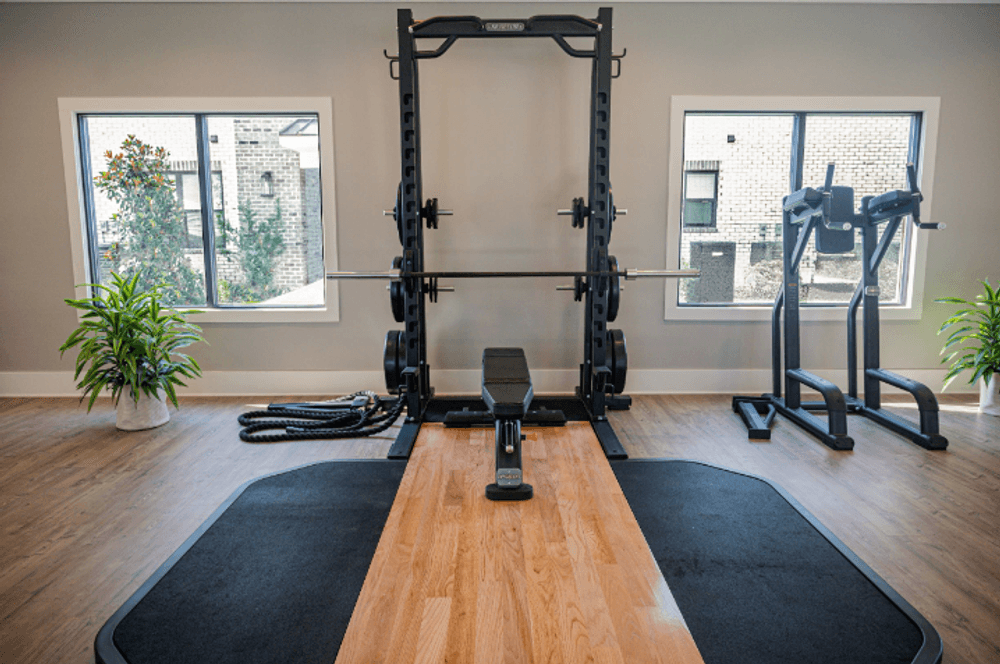 a home gym with weights and yoga machines on a yoga board