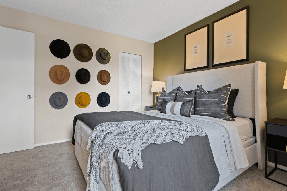 the preserve at ballantyne commons bedroom with bed and wall decor