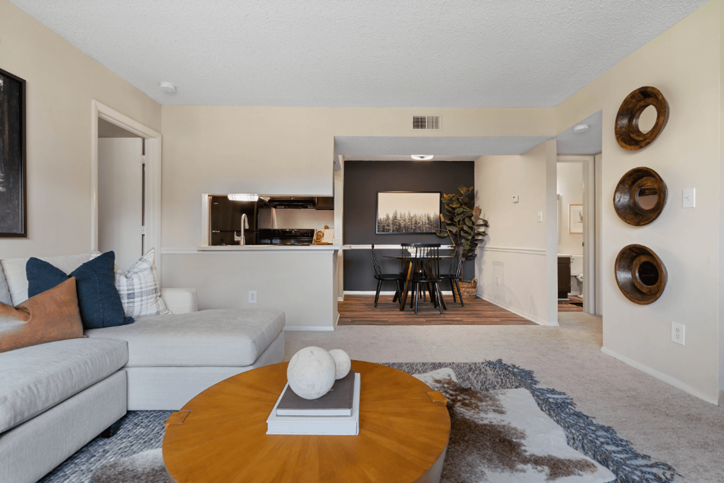a living room with a couch and a table