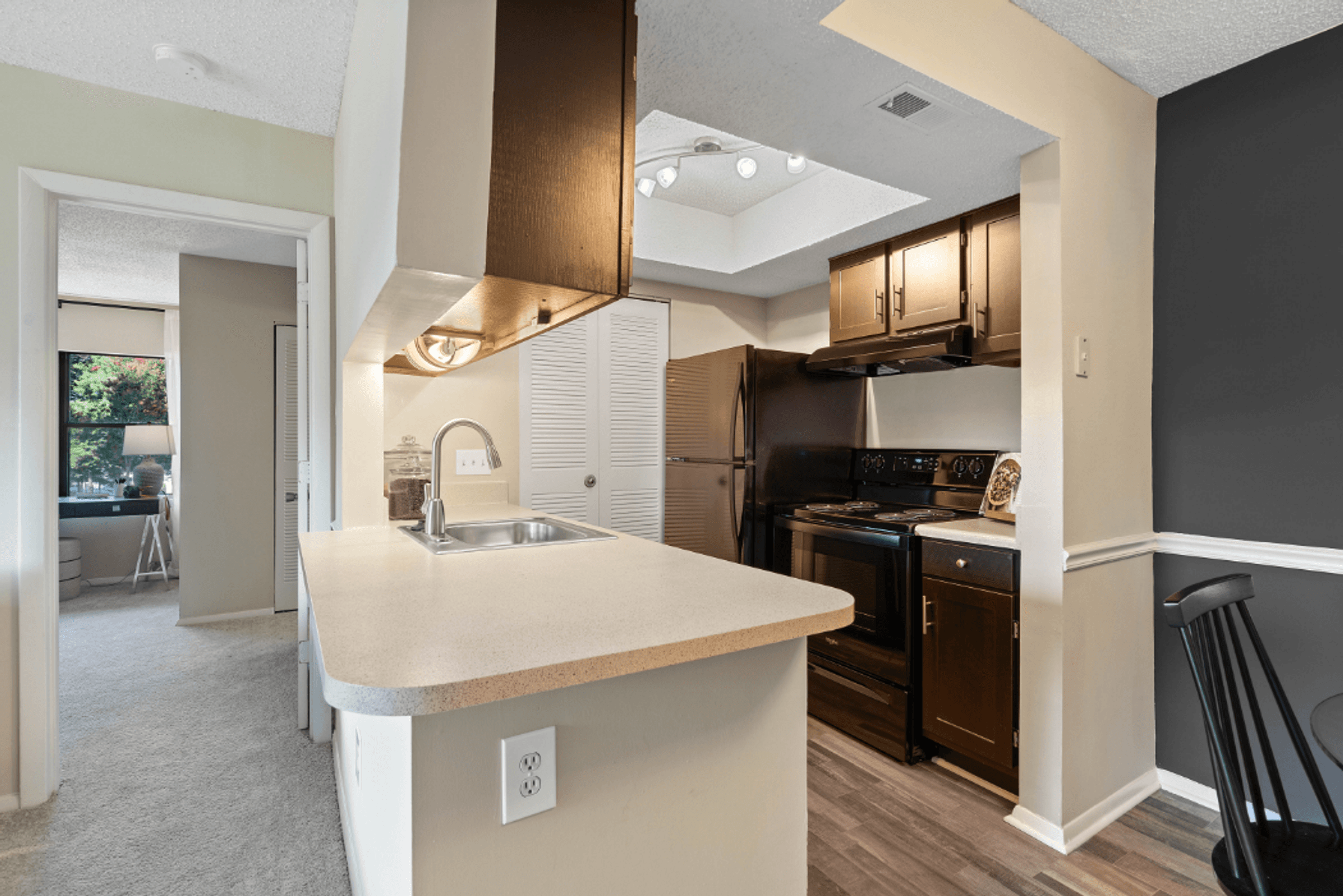 Espresso Cabinetry with Black Appliances