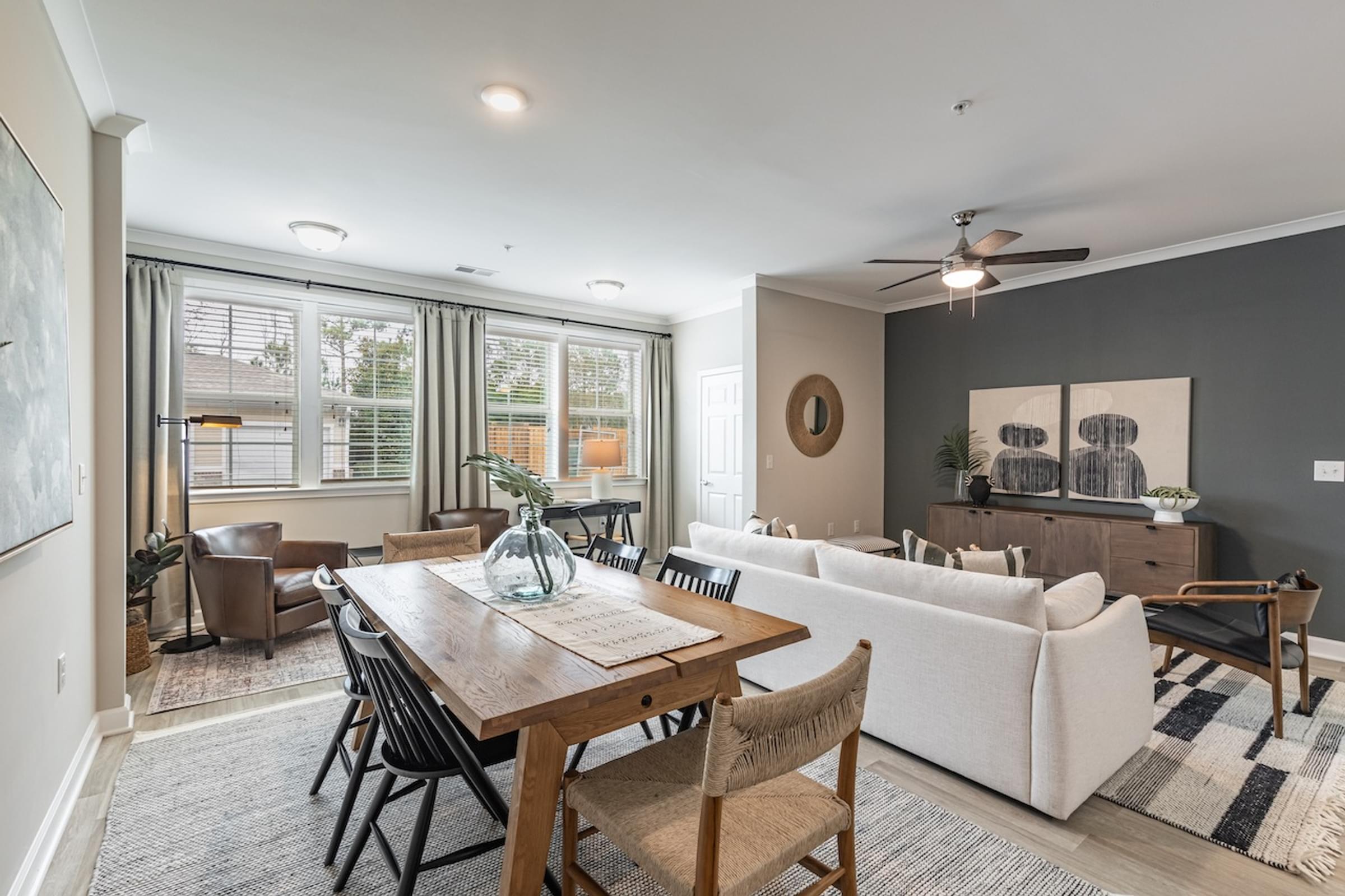 an open living room and dining room with a table and chairs