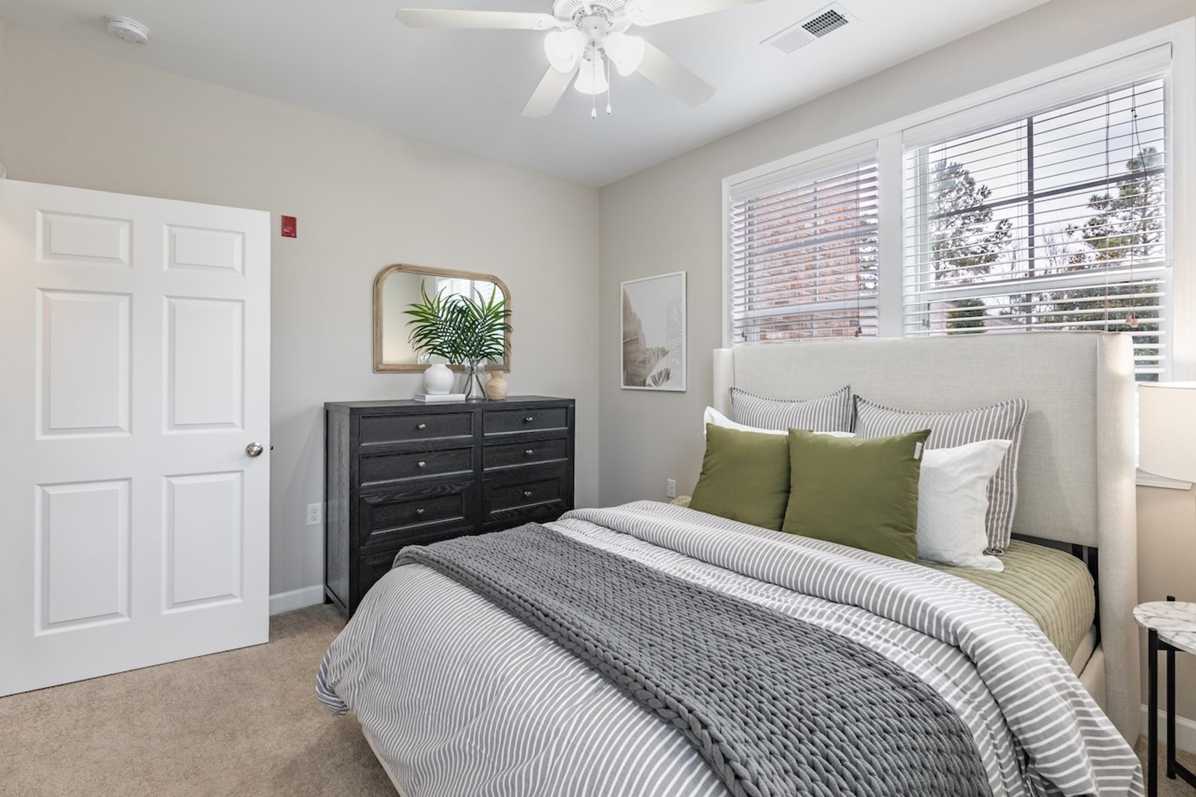 a bedroom with a bed and a closet