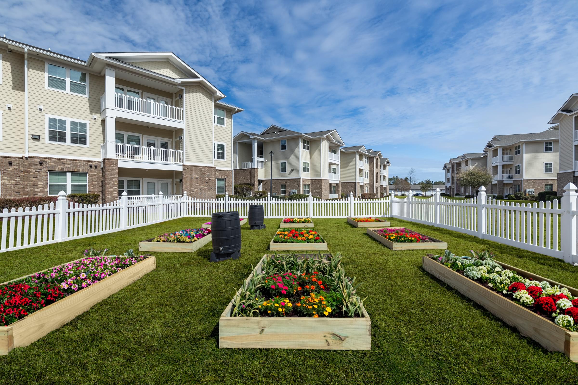 a community garden in front of an apartment building