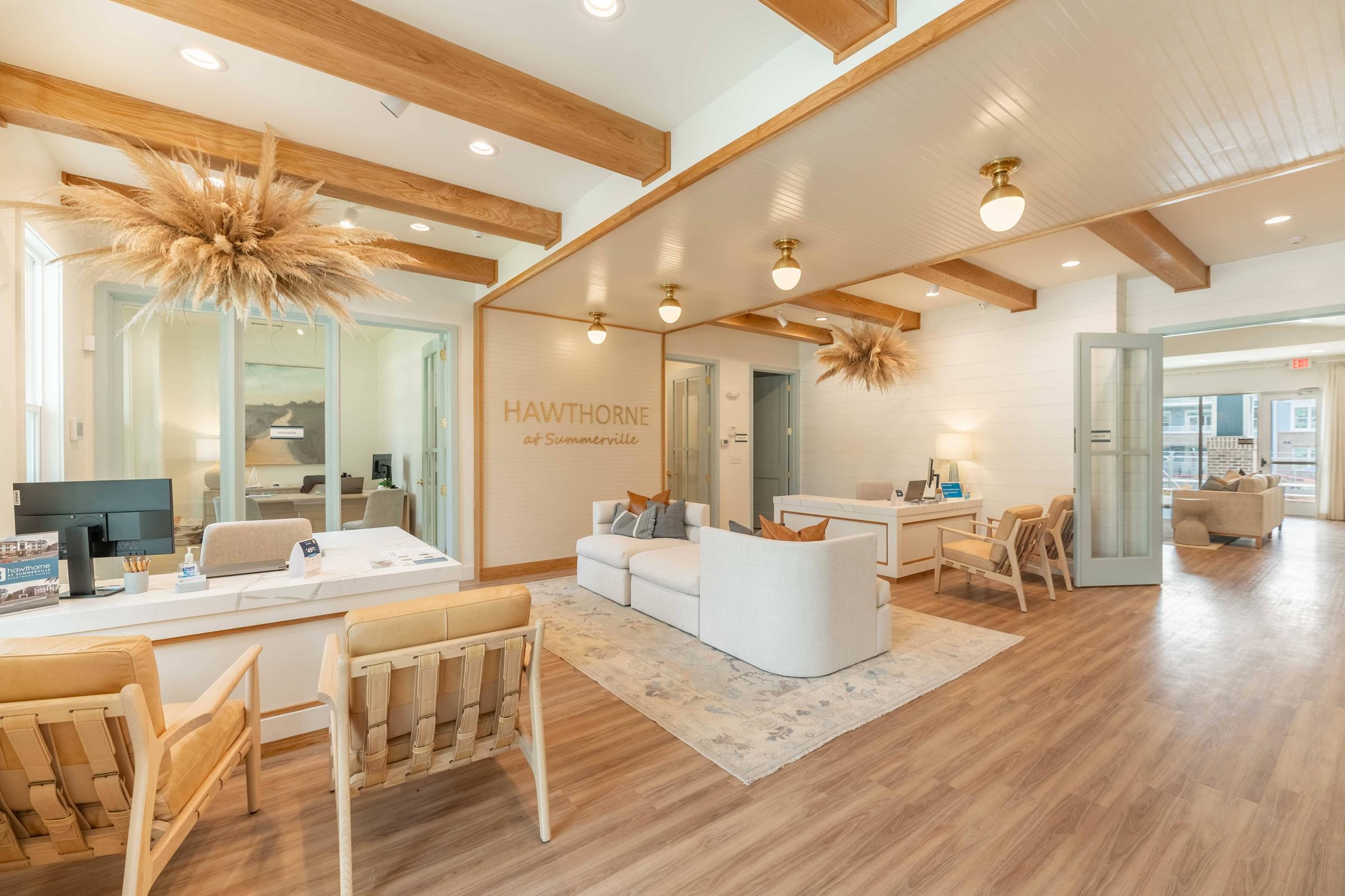 a living room with wooden floors and a white couch