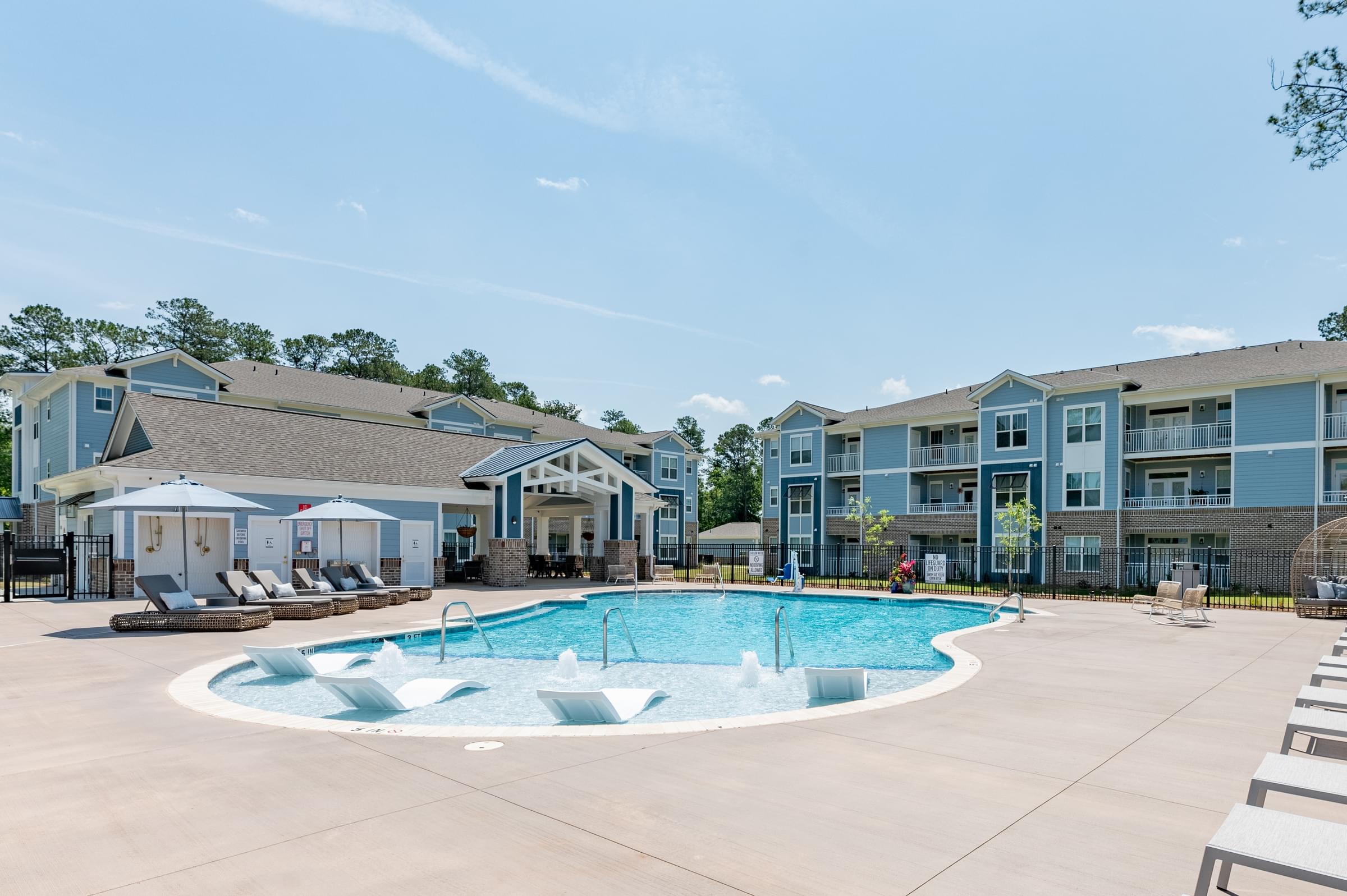 the preserve at ballantyne commons community swimming pool with apartment buildings
