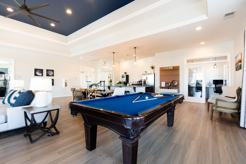 a pool table in the middle of a living room