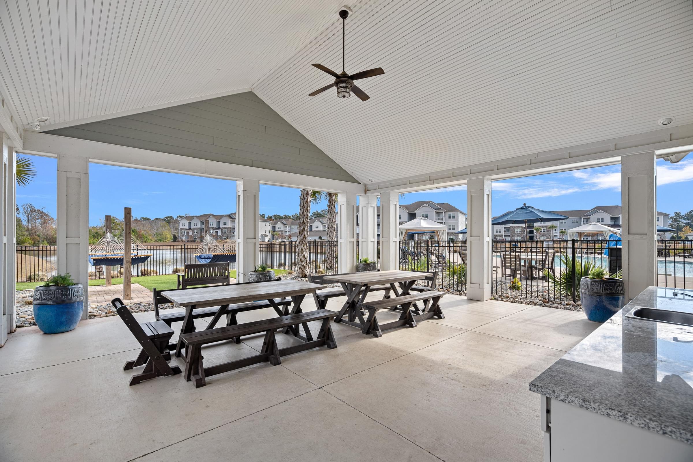 A patio with a table and benches is shown.
