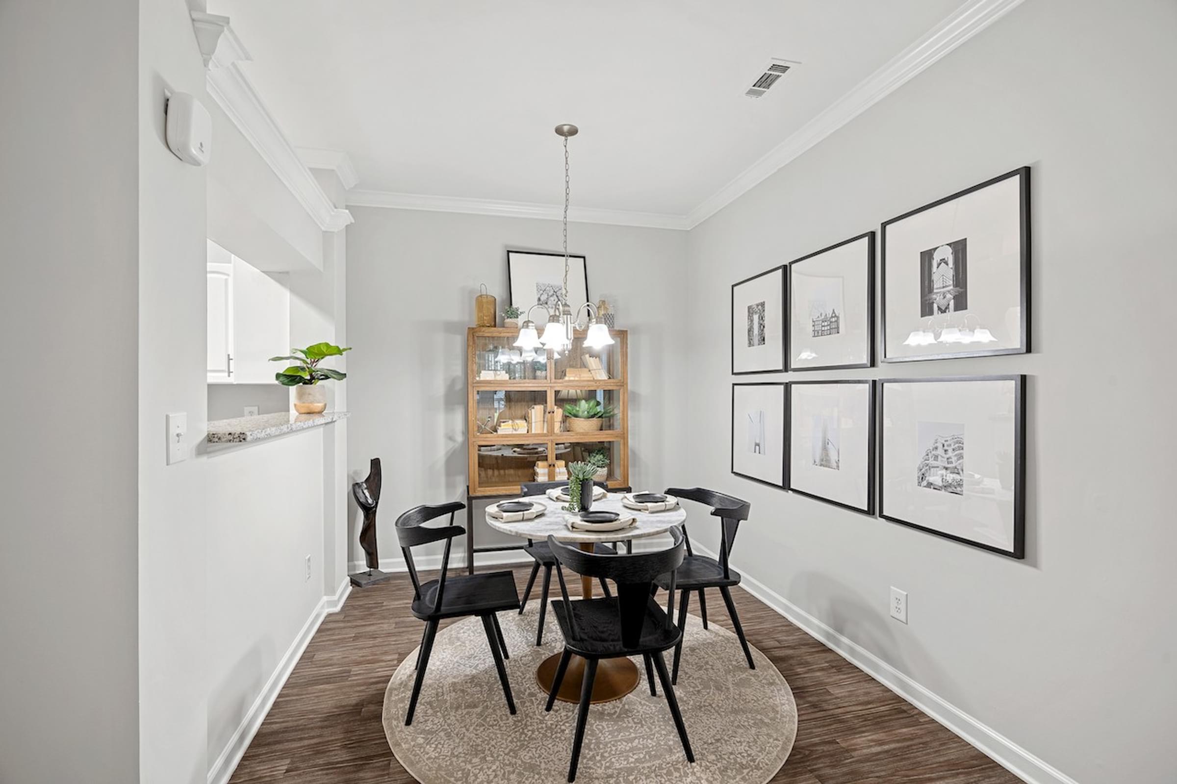 an image of a dining room with a table and chairs