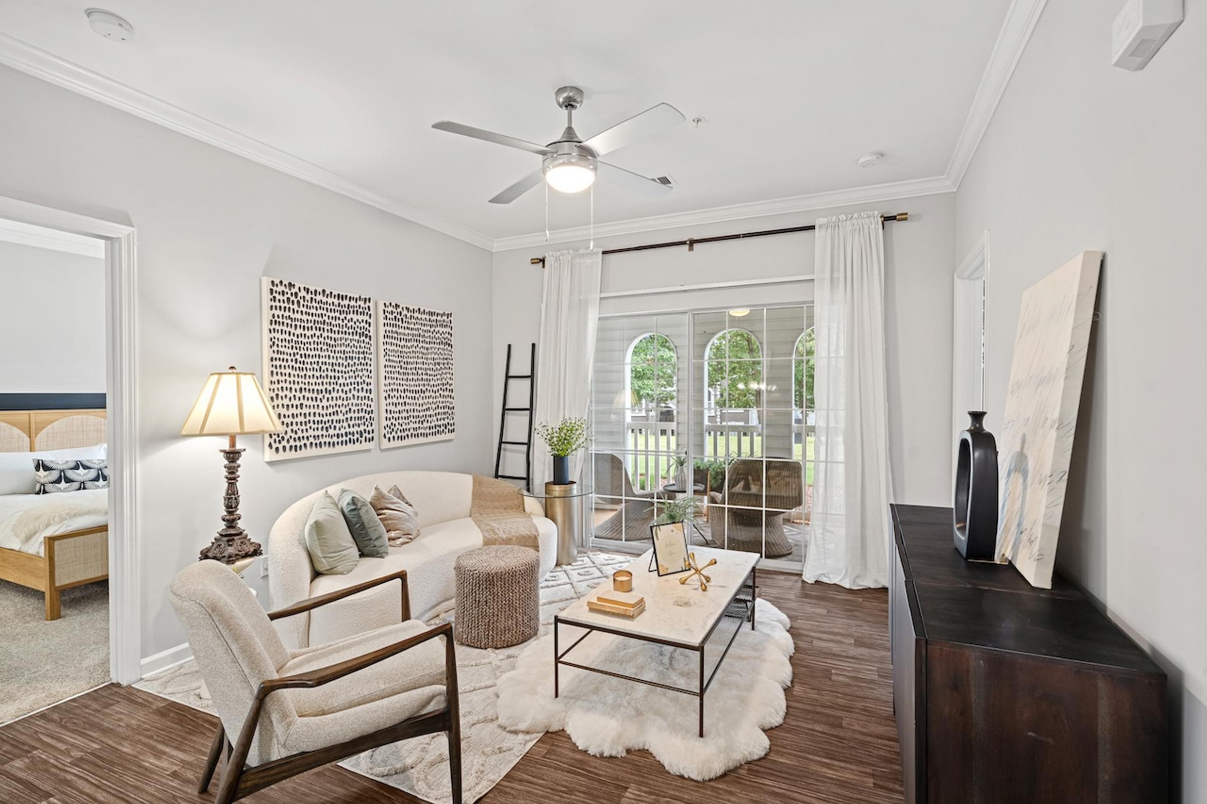 Spacious living room that peeks into the outdoor patio space