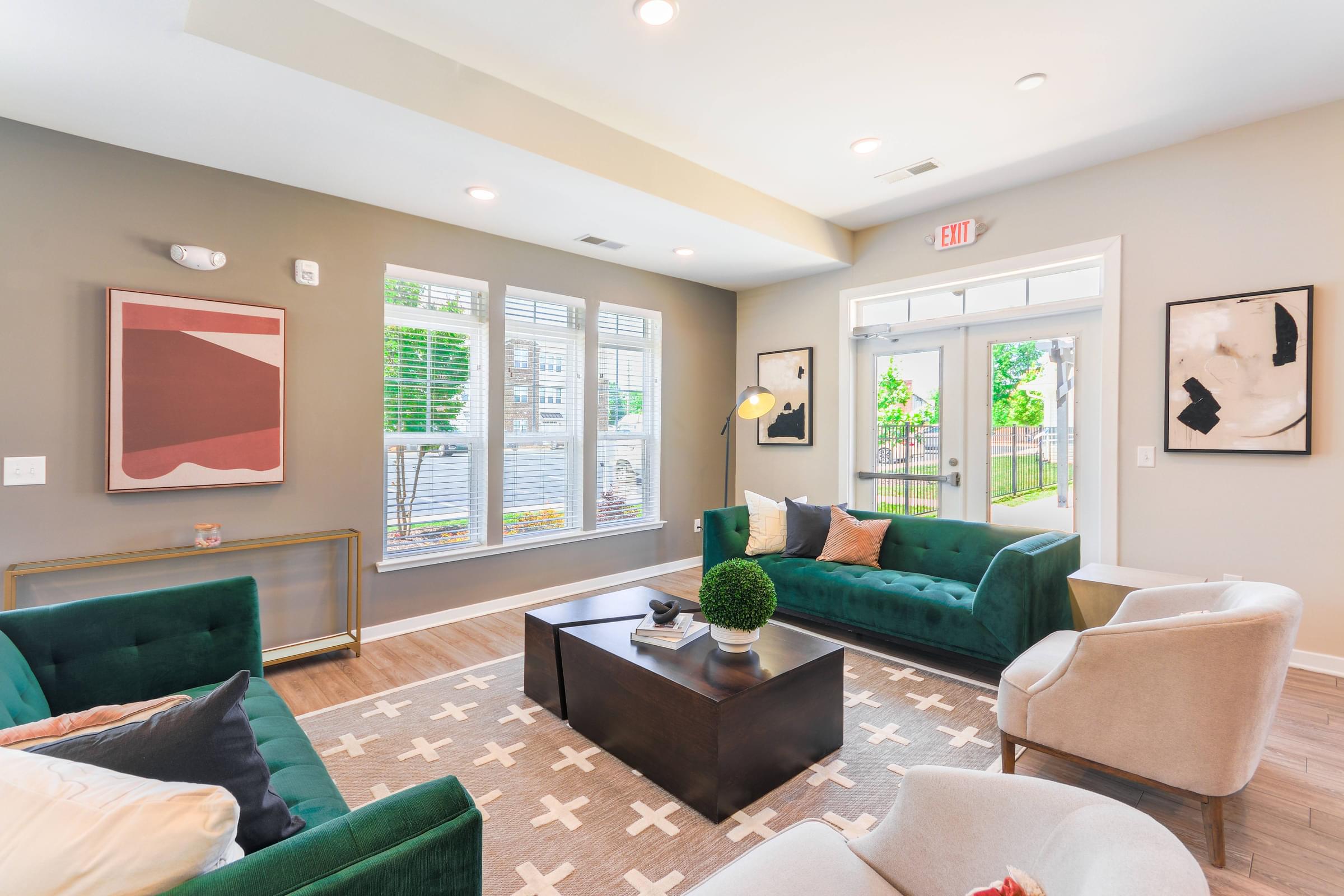 a living room with couches and chairs and a coffee table