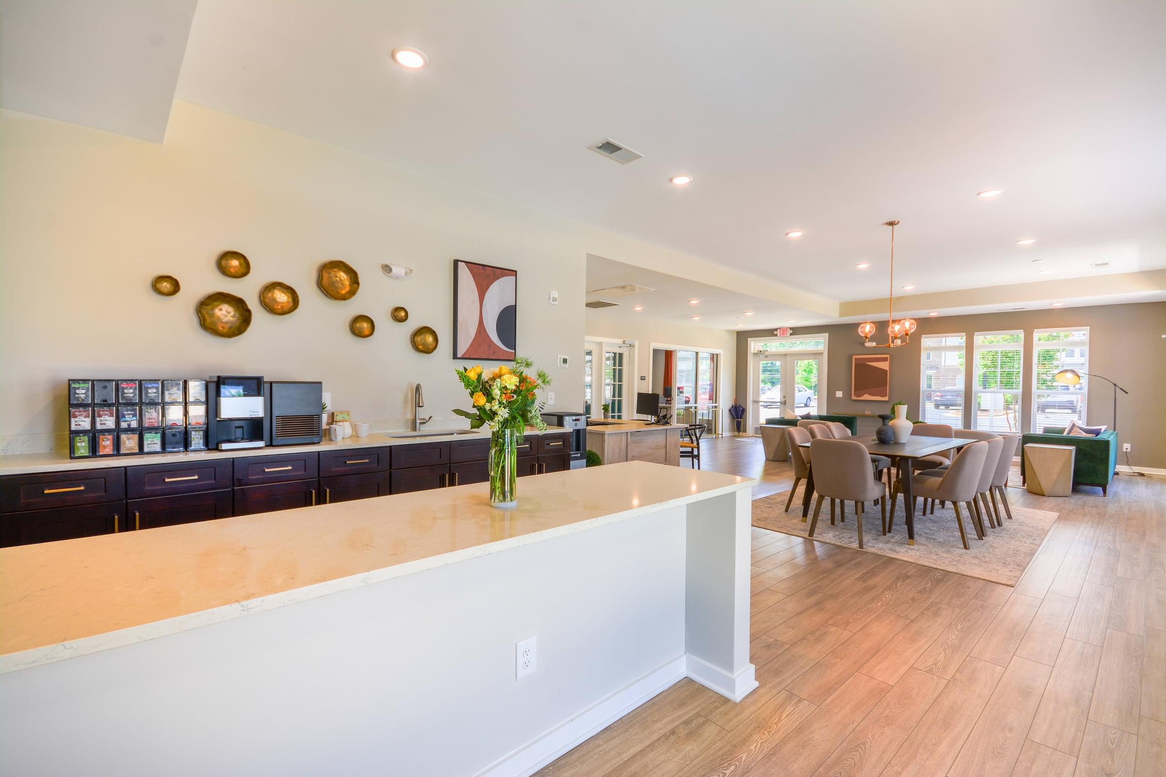 a large kitchen and dining room with a table and chairs