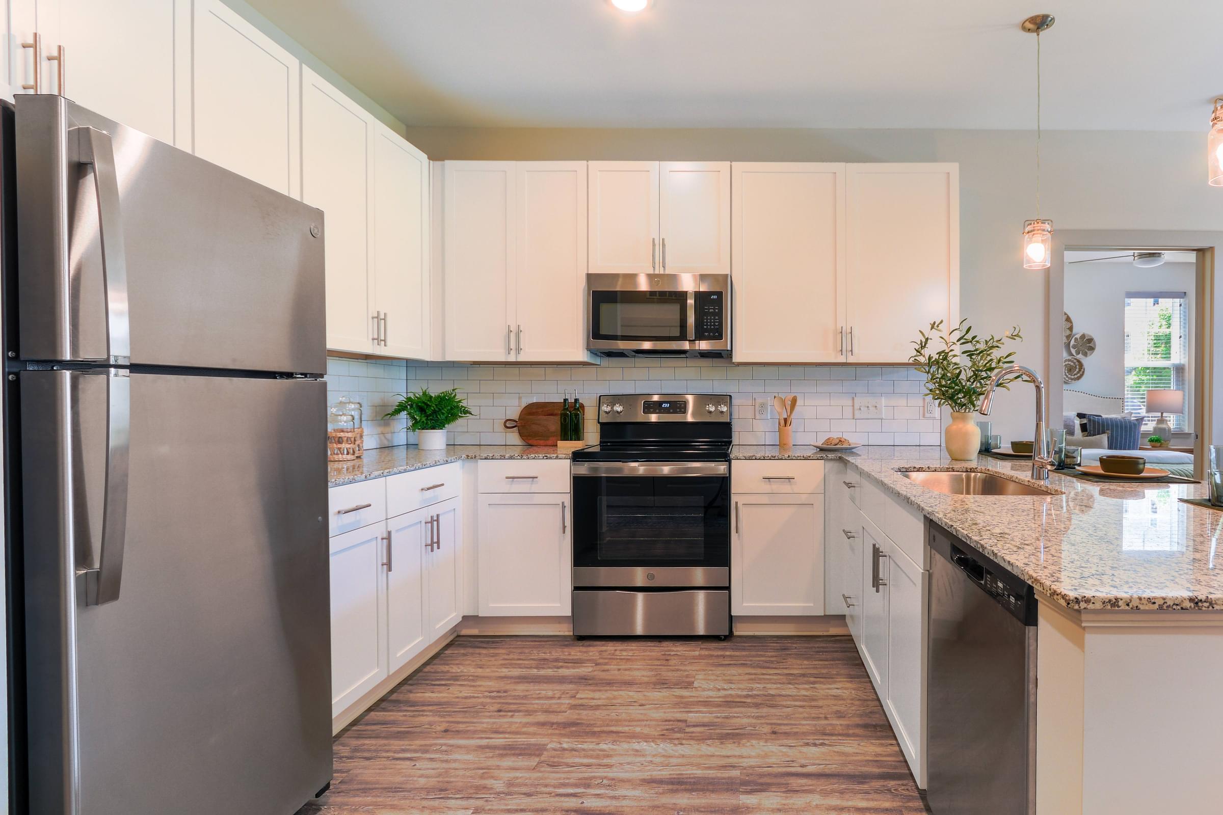 Custom Designed Kitchen With Stainless Steel Appliances and Granite Countertops