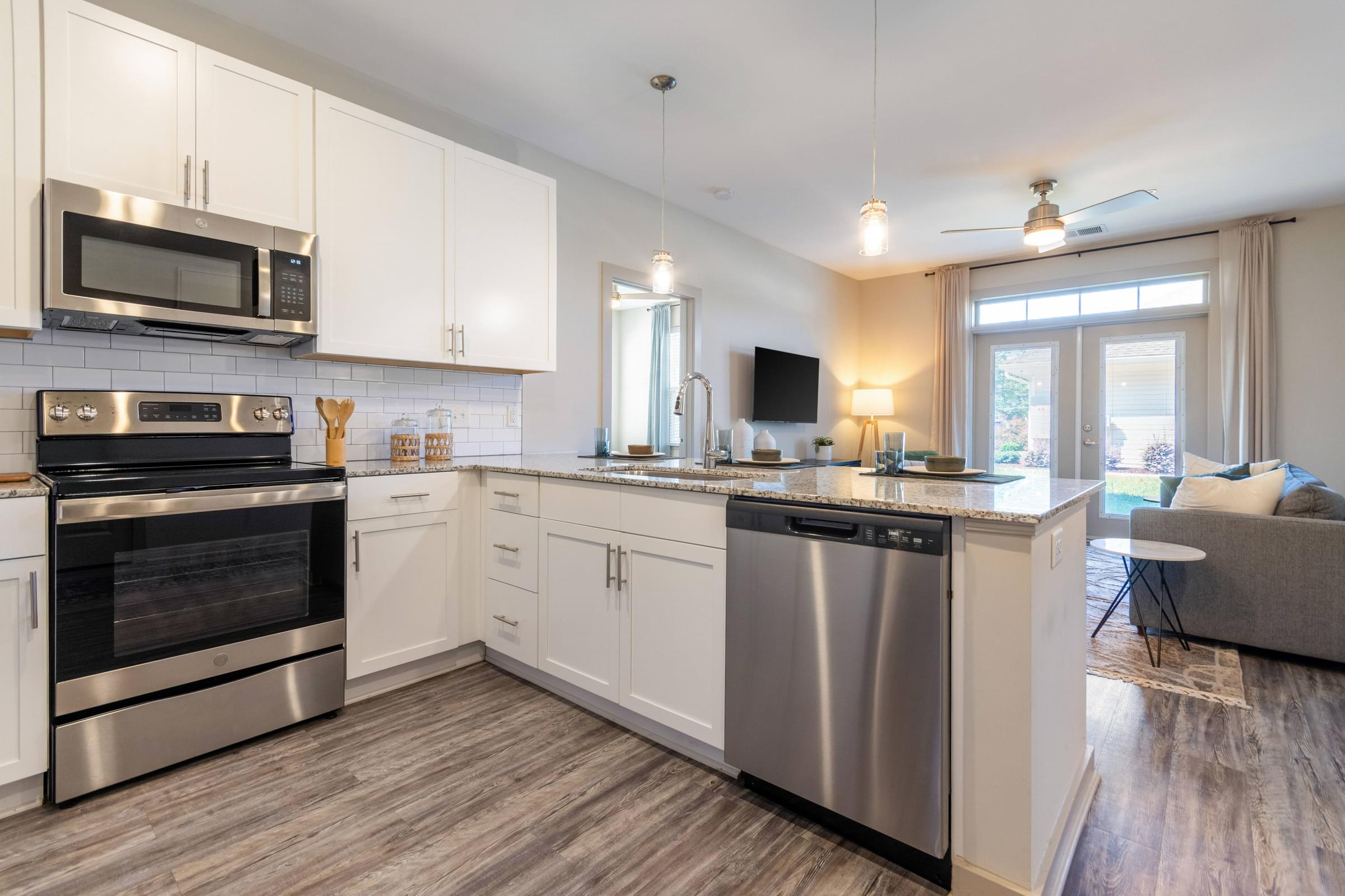 Custom Designed Kitchen With Stainless Steel Appliances and Granite Countertops