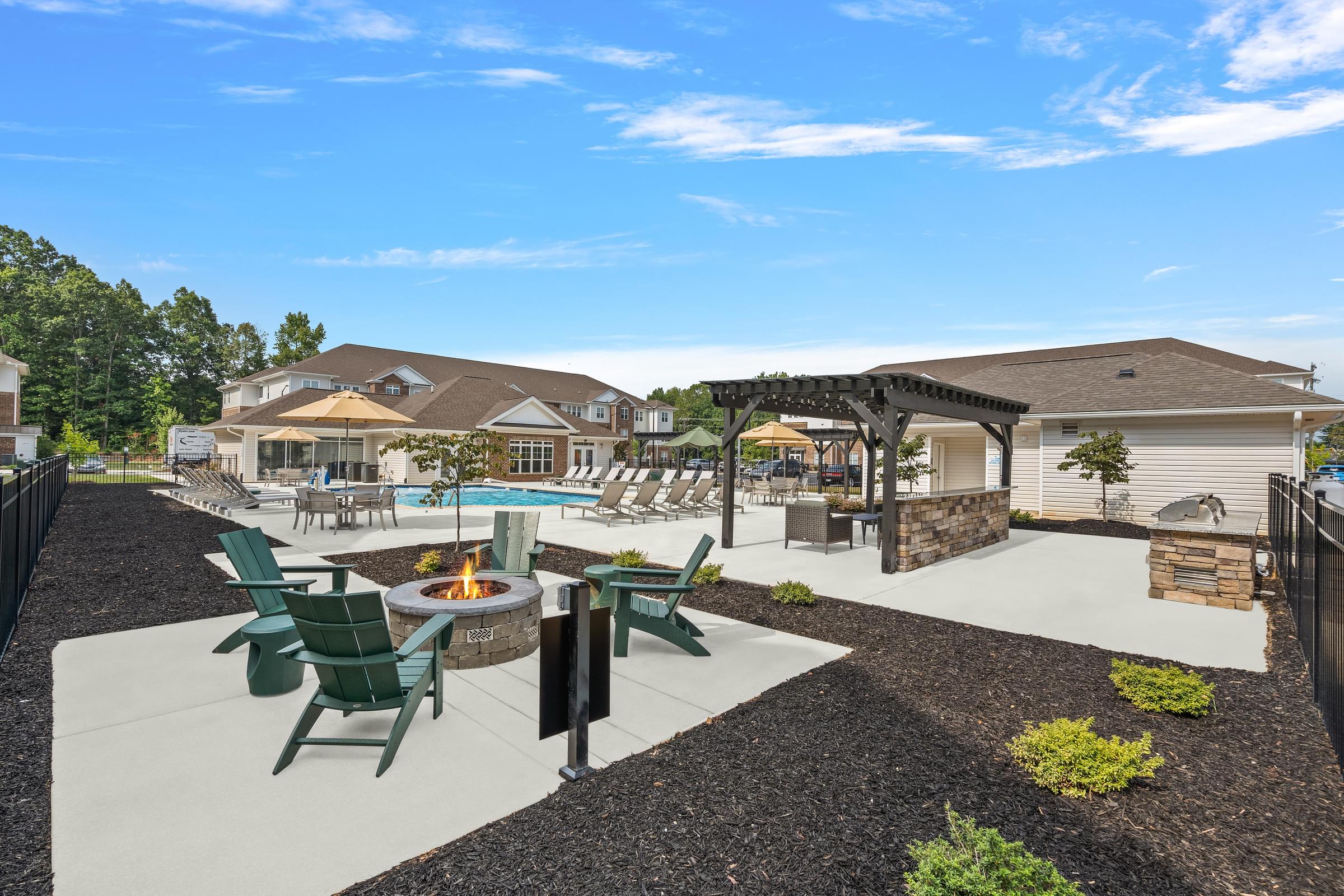 Resort Style Outdoor Amenity Space With Fire Pit And Salt Water Swimming Pool