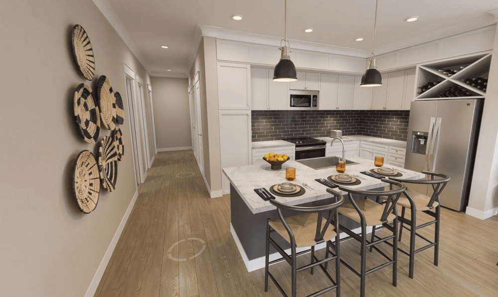 2 bedroom apartment kitchen and living area with pendant lighting, large kitchen island, and open concept layout