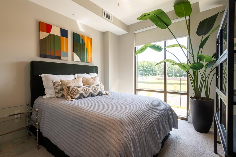 Large apartment kitchen with ample cabinet storage, built-in wine storage, and stainless steel appliances
