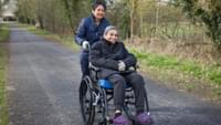Carer Pushing an Elderly Man