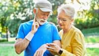 Elderly Couple Checking Smartwatches