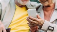 Elderly Couple Using Smartphone