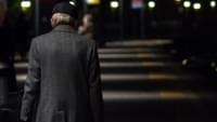 Elderly Man Walking at Night