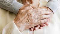 Elderly Person Holding Hands